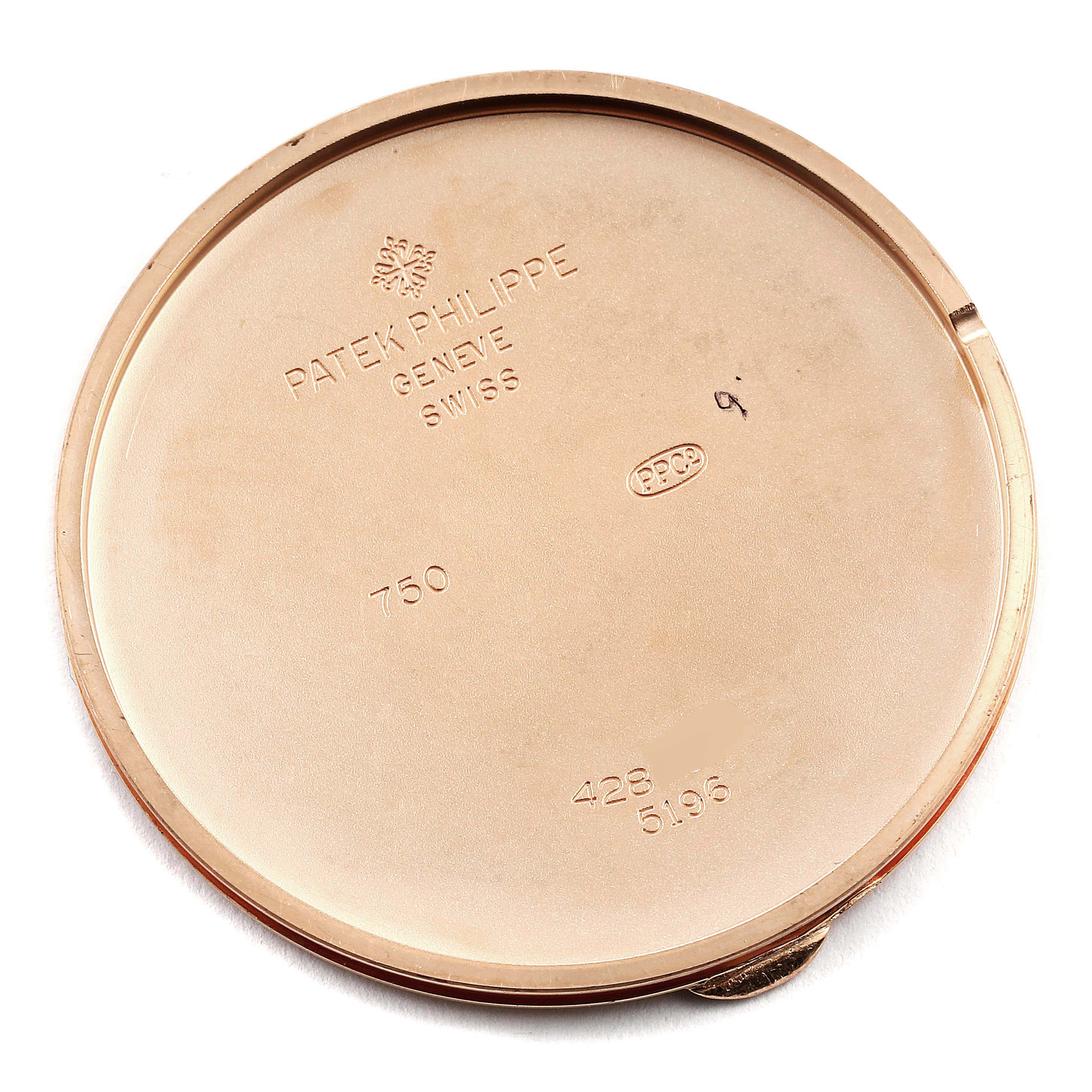This image shows the back cover of a Patek Philippe Calatrava 5196R Men's Rose Gold Silver Dial 5196R Men's Rose Gold Silver Dial watch, displaying engravings and hallmarks.