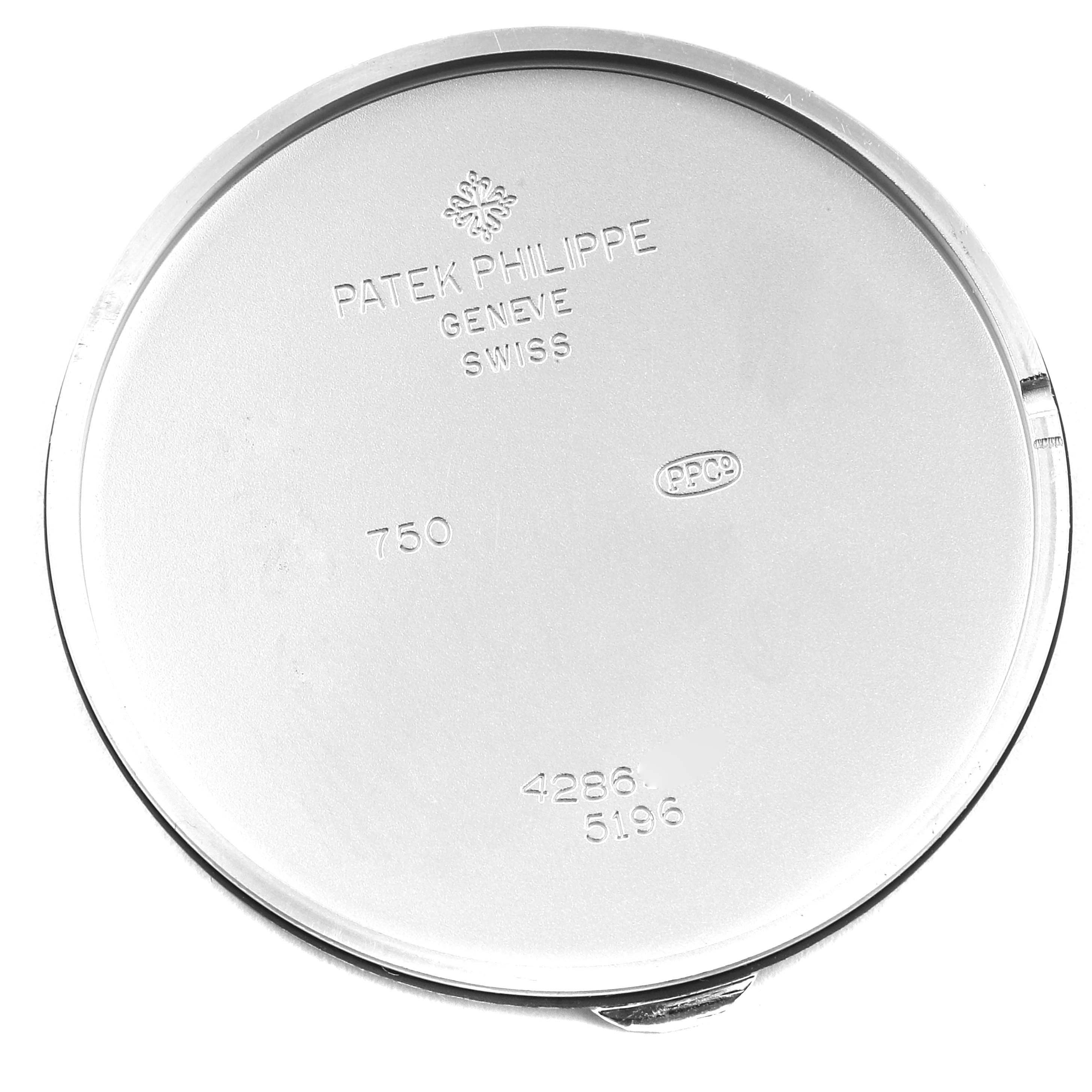 This image shows the case back of a Patek Philippe Calatrava 5196G Men's White Gold Silver Dial 5196G Men's White Gold Silver Dial watch, featuring brand engravings and serial numbers.