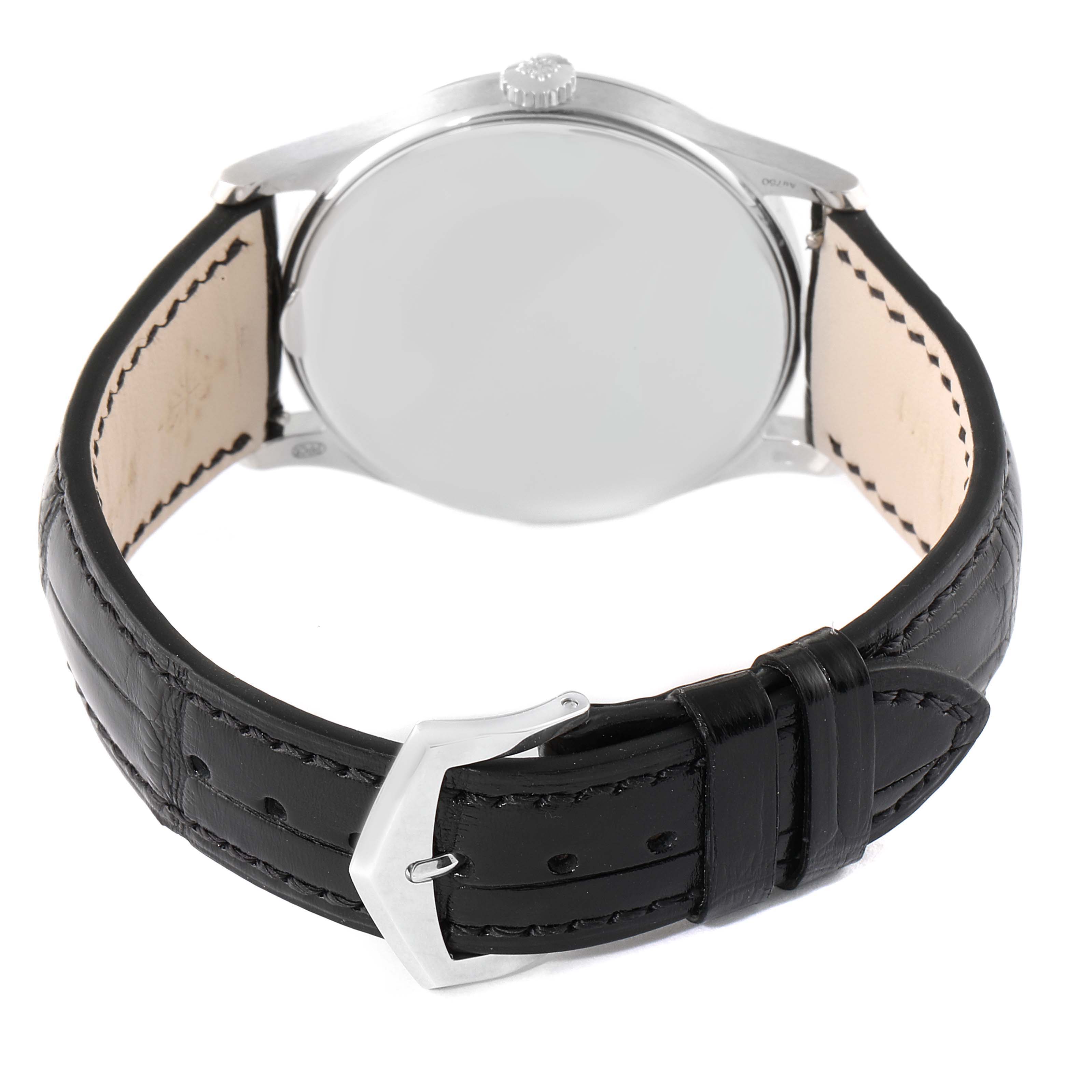 The image shows the back view of a Patek Philippe Calatrava 5196G Men's White Gold Silver Dial 5196G Men's White Gold Silver Dial watch, highlighting the case back, crown, and black leather strap with a buckle.