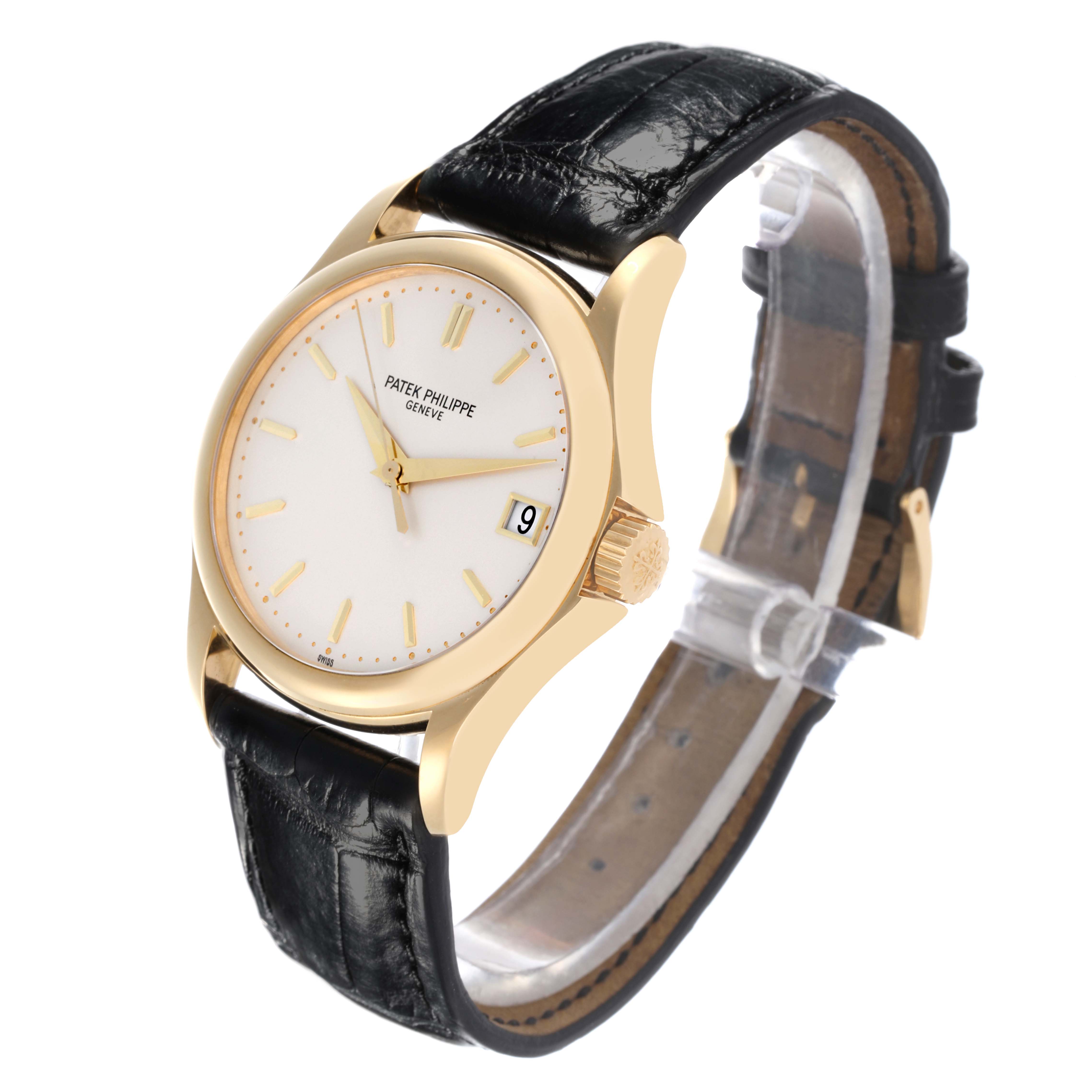 The Patek Philippe Calatrava 5127J-001 Men's Yellow Gold Silver Dial 5127J-001 Men's Yellow Gold Silver Dial watch is shown at a front-right angle, highlighting the face, crown, and black leather strap.