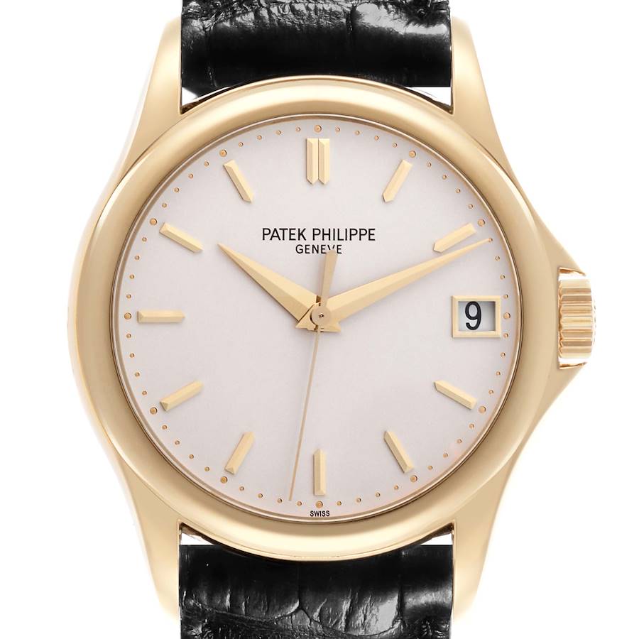 The image shows a front view of a Patek Philippe Calatrava watch, displaying the dial, hands, and a date window.