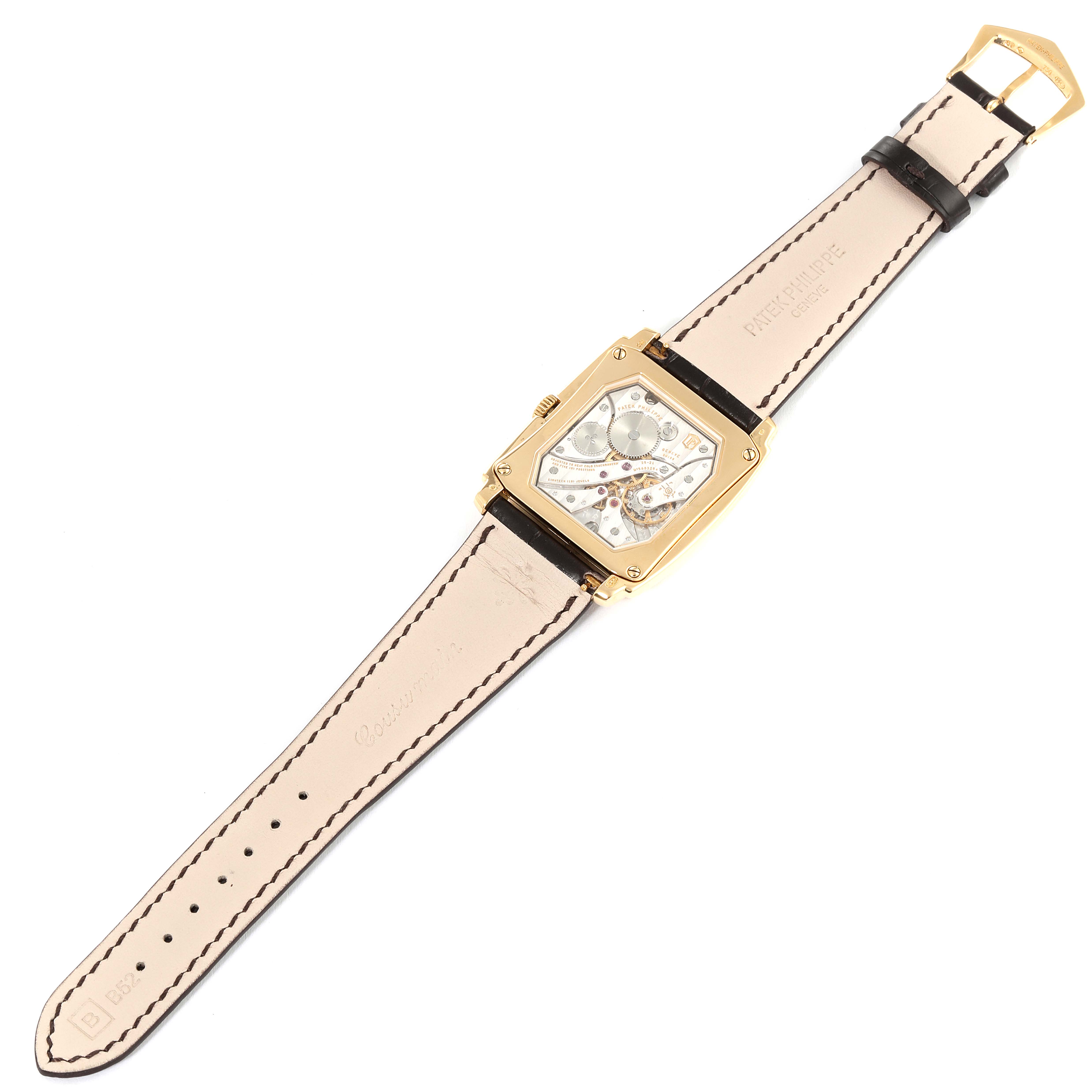 The image shows a top-down view of the back of the Patek Philippe Gondolo 5124J Men's Yellow Gold Silver Dial 5124J Men's Yellow Gold Silver Dial watch, displaying its inner mechanism and leather strap.