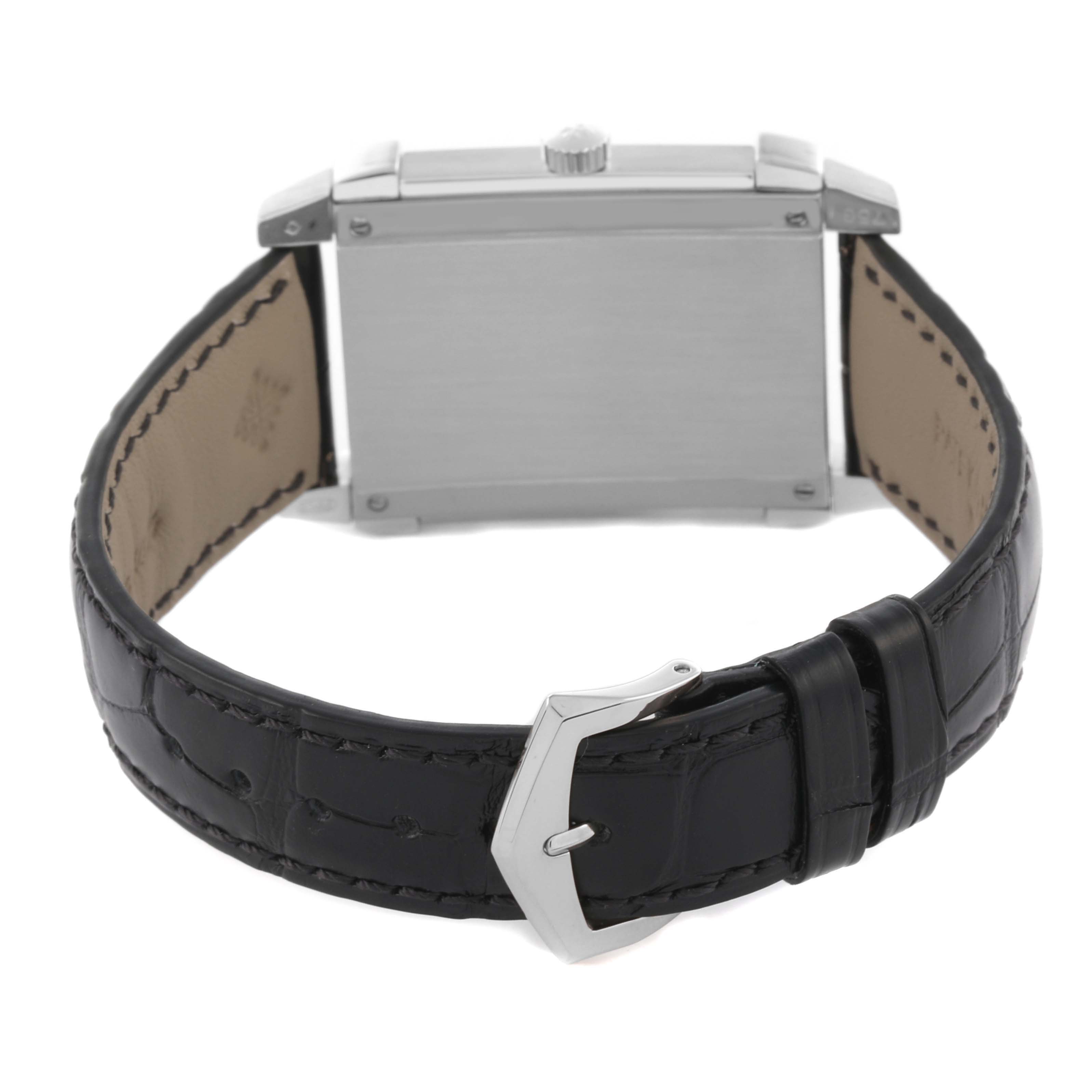 The Patek Philippe Gondolo 5111G-001 Men's White Gold Silver Dial 5111G-001 Men's White Gold Silver Dial watch is shown from the back, highlighting the case and black leather strap with a clasp.