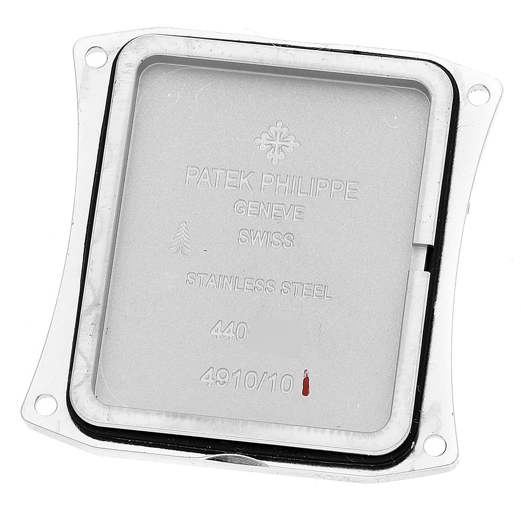 The image shows the back cover of a Patek Philippe Twenty-4 4910 Women's Stainless Steel Grey Dial 4910 Women's Stainless Steel Grey Dial watch, displaying the engravings on the stainless steel surface.