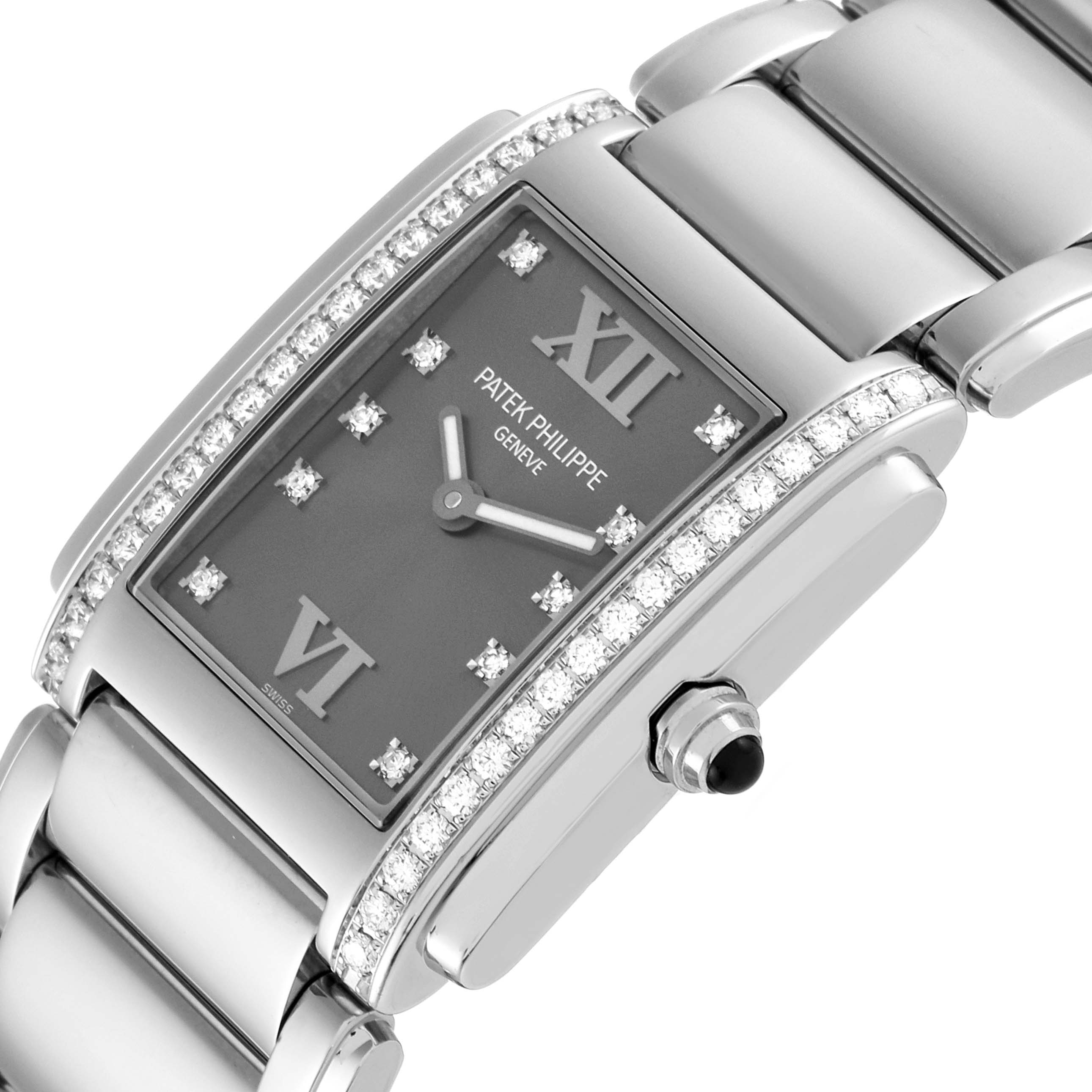 The image shows a close-up of the face and bracelet of the Patek Philippe Twenty-4 4910 Women's Stainless Steel Grey Dial 4910 Women's Stainless Steel Grey Dial watch, featuring diamond accents and a black crown.