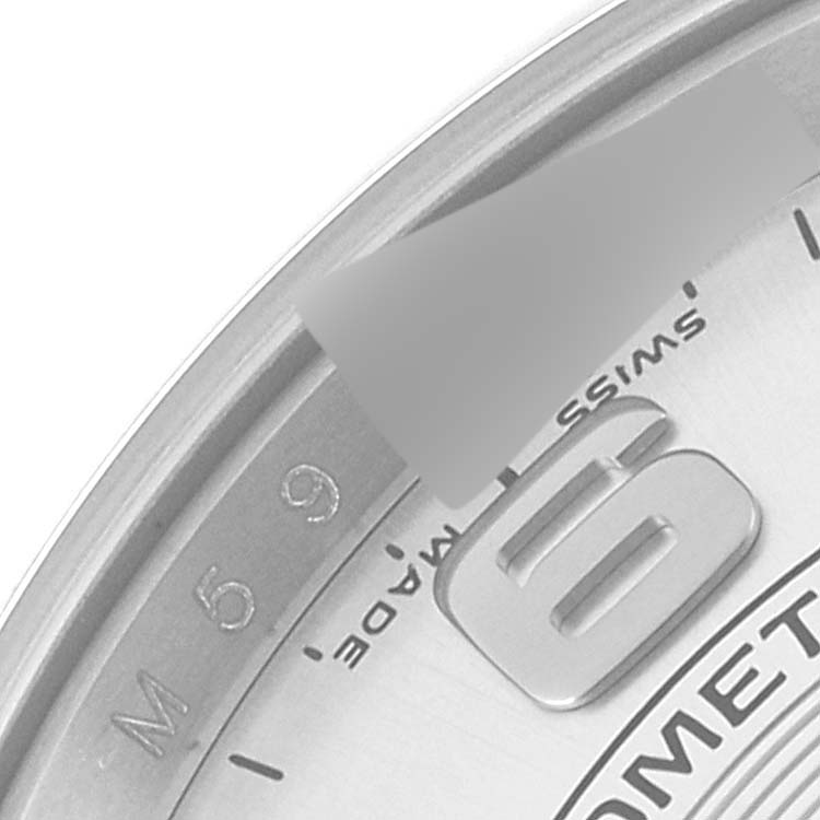The close-up image shows the 6 o'clock section of the dial on a Rolex Oyster Perpetual 114200 Men's Stainless Steel Silver Dial 114200 Men's Stainless Steel Silver Dial watch, featuring the "SWISS MADE" text.