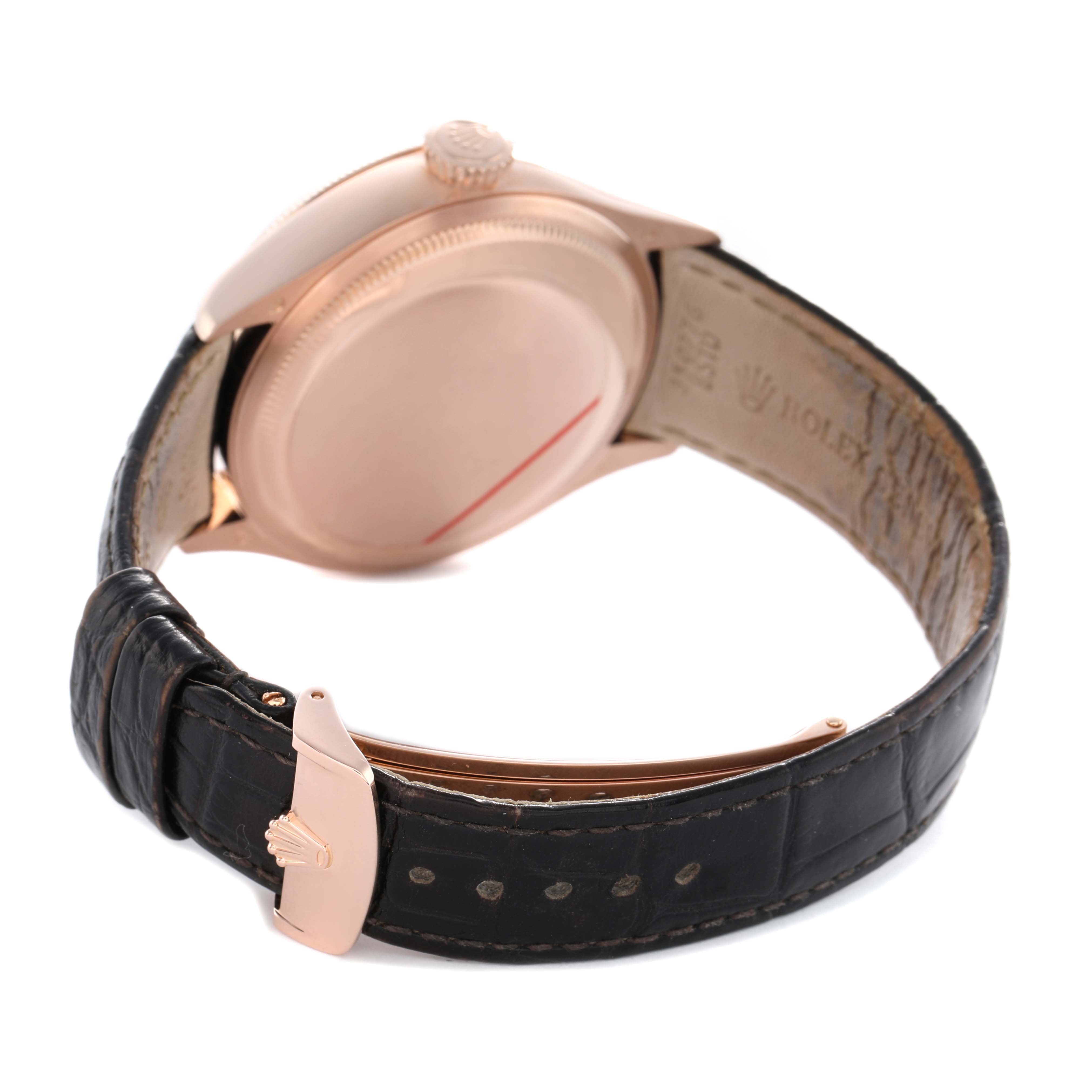 The Rolex Cellini 50535 Men's Rose Gold White Dial watch is shown from a rear angle, highlighting the case back, crown, and leather strap with a clasp.