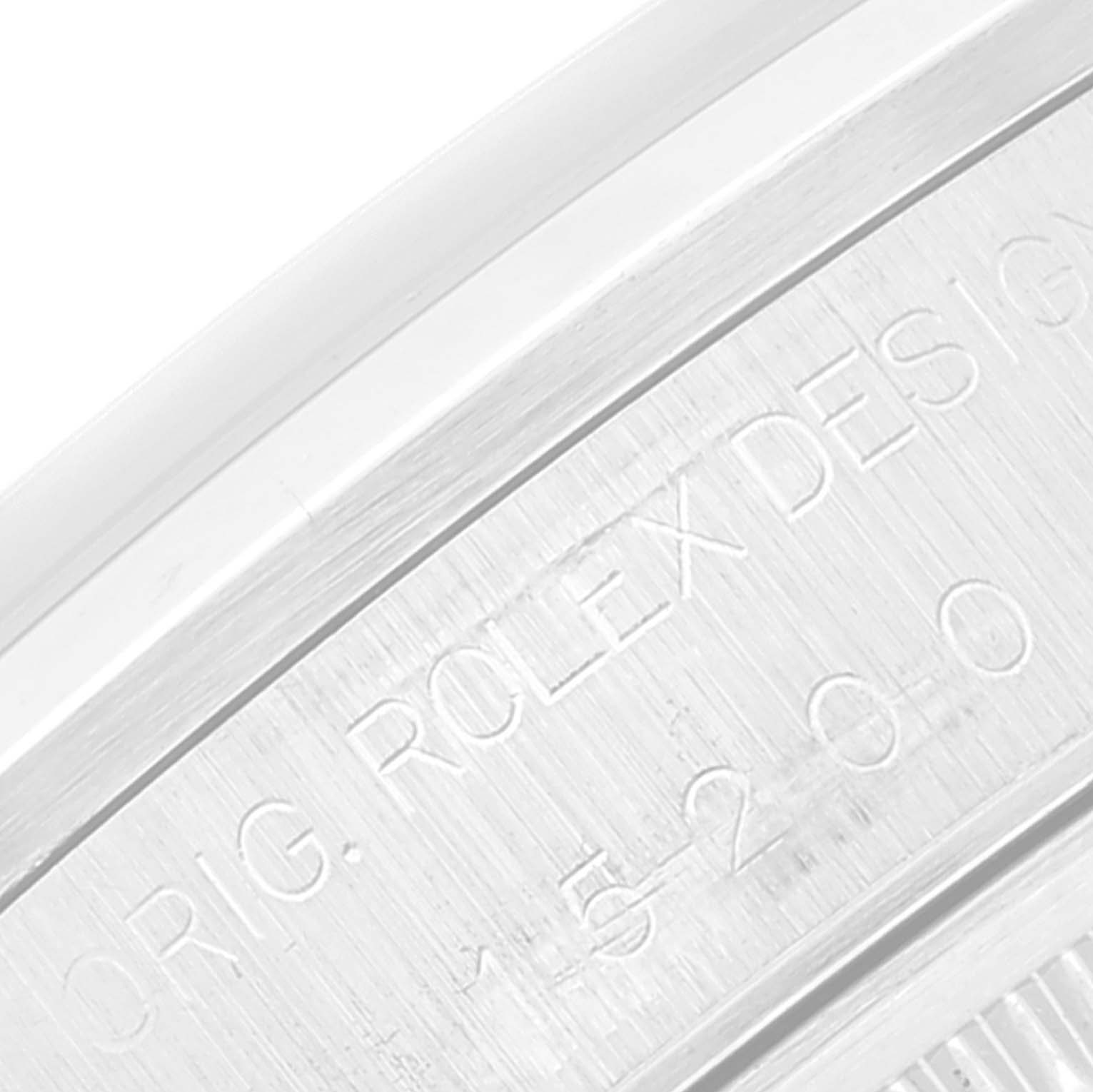 The image shows a close-up view of the serial number and engravings on the case of a Rolex Date 15200 Men
s Stainless Steel Black Dial 15200 Men
s Stainless Steel Black Dial model watch.