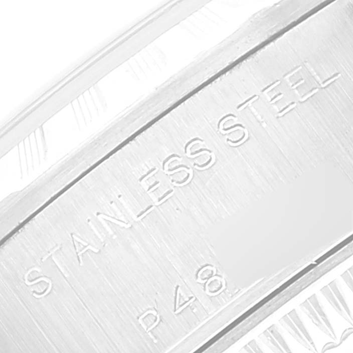 The image shows a close-up of the stainless steel case back with engraved text of a Rolex Date 79240 Women's Stainless Steel Pink Dial 79240 Women's Stainless Steel Pink Dial model watch.