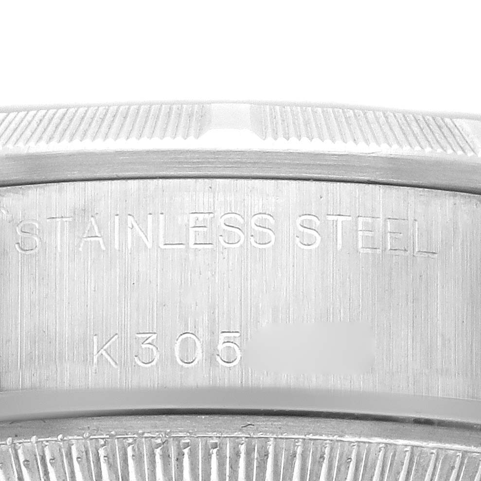 The image shows a close-up of the case edge, displaying the stainless steel marking on the Rolex Date 79190 Women
s Stainless Steel Silver Dial 79190 Women
s Stainless Steel Silver Dial model.