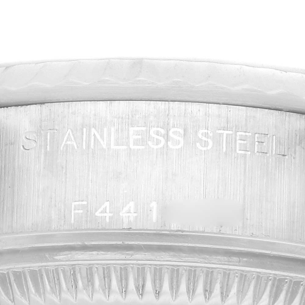 The image shows a close-up of the side of a Rolex Datejust 79174 Women's Stainless Steel Mother of Pearl Dial 79174 Women's Stainless Steel Mother of Pearl Dial, displaying the "STAINLESS STEEL" engraving on the case.