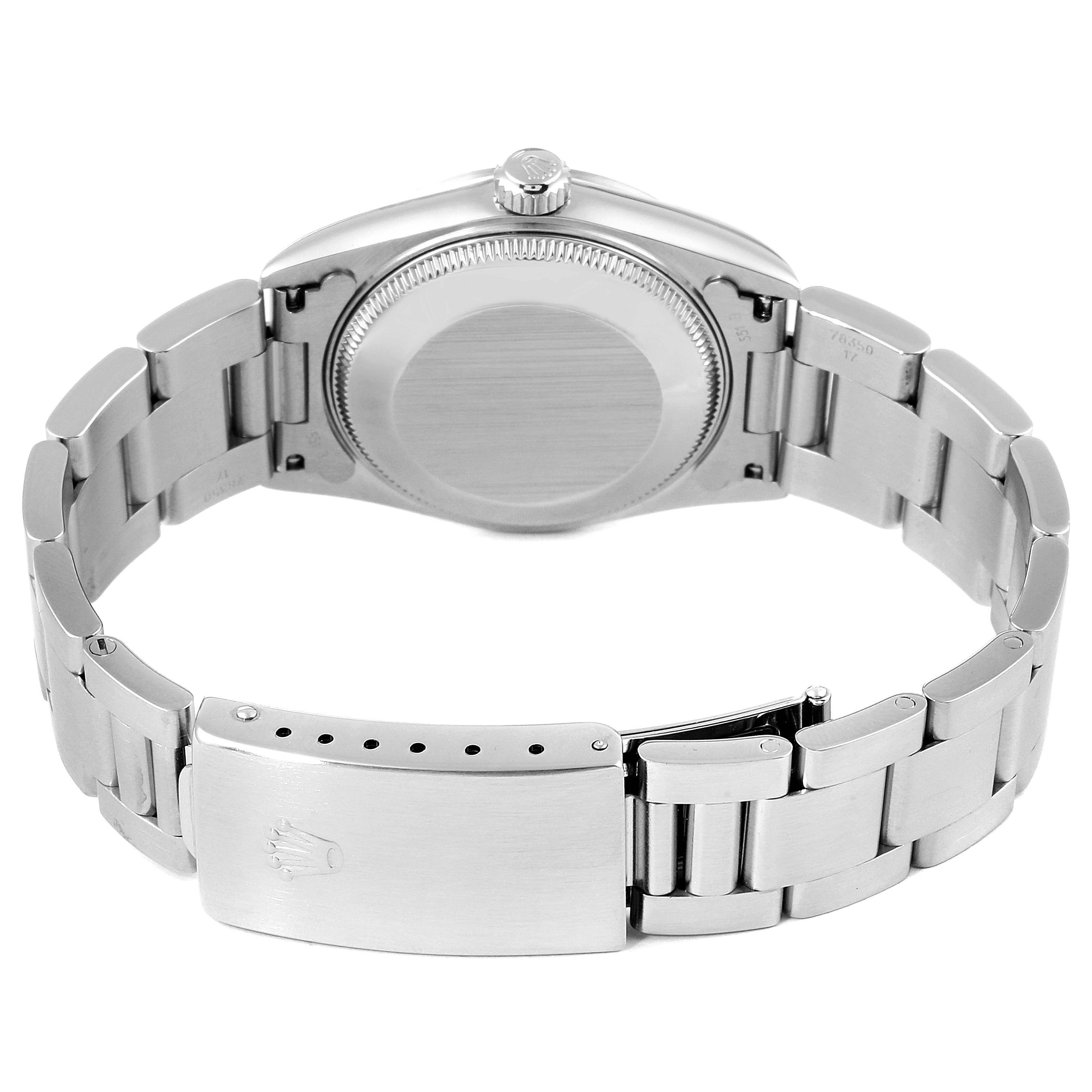 This image shows the back side and bracelet of a mid-size Rolex watch.