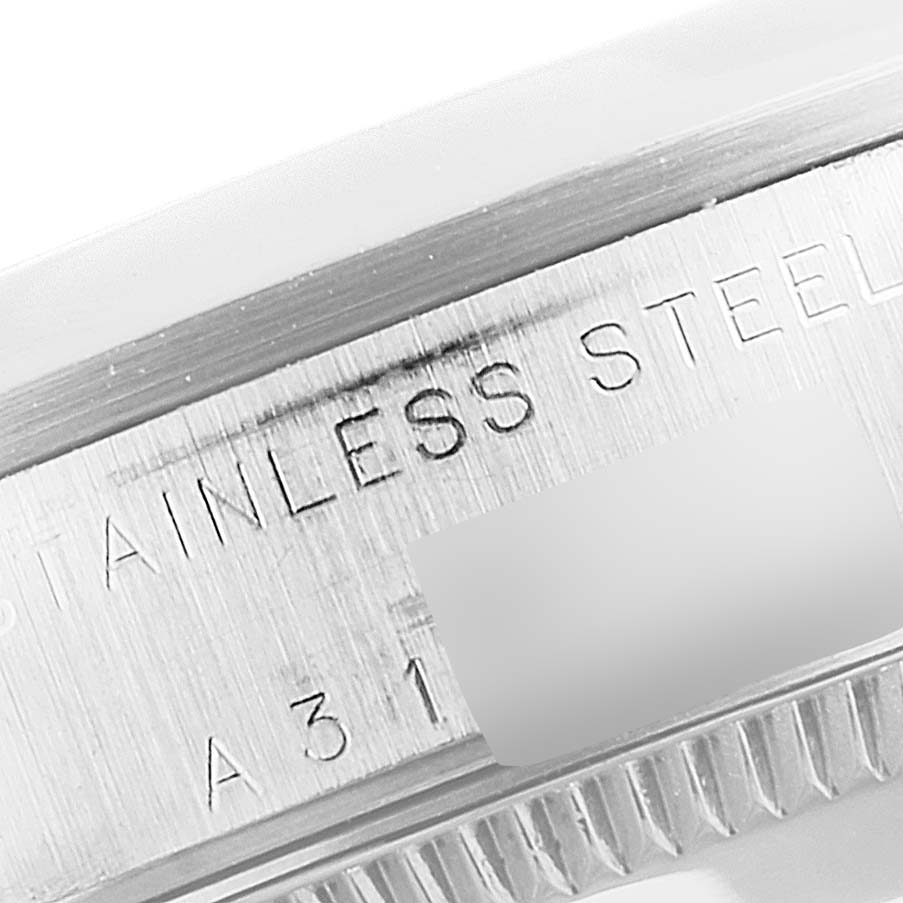 This close-up view of the Rolex Mid-Size 78240 Women's Stainless Steel White Dial 78240 Women's Stainless Steel White Dial model shows the engraved text on its stainless steel case.