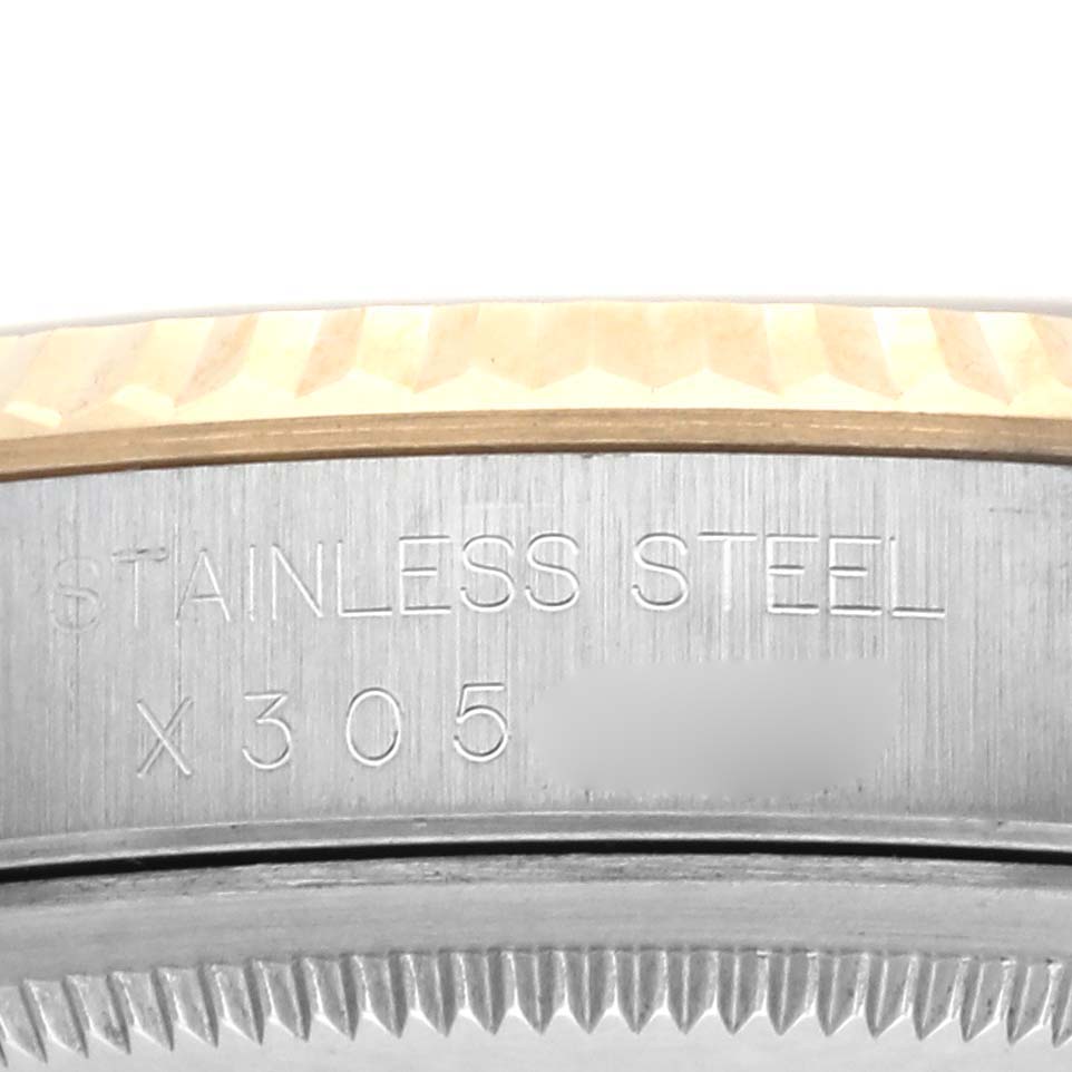 The image shows a close-up of the side of a Rolex Datejust 16233 Men's Steel and Gold (two tone) Champagne Dial 16233 Men's Steel and Gold (two tone) Champagne Dial watch, highlighting the stainless steel case and part of the bezel.