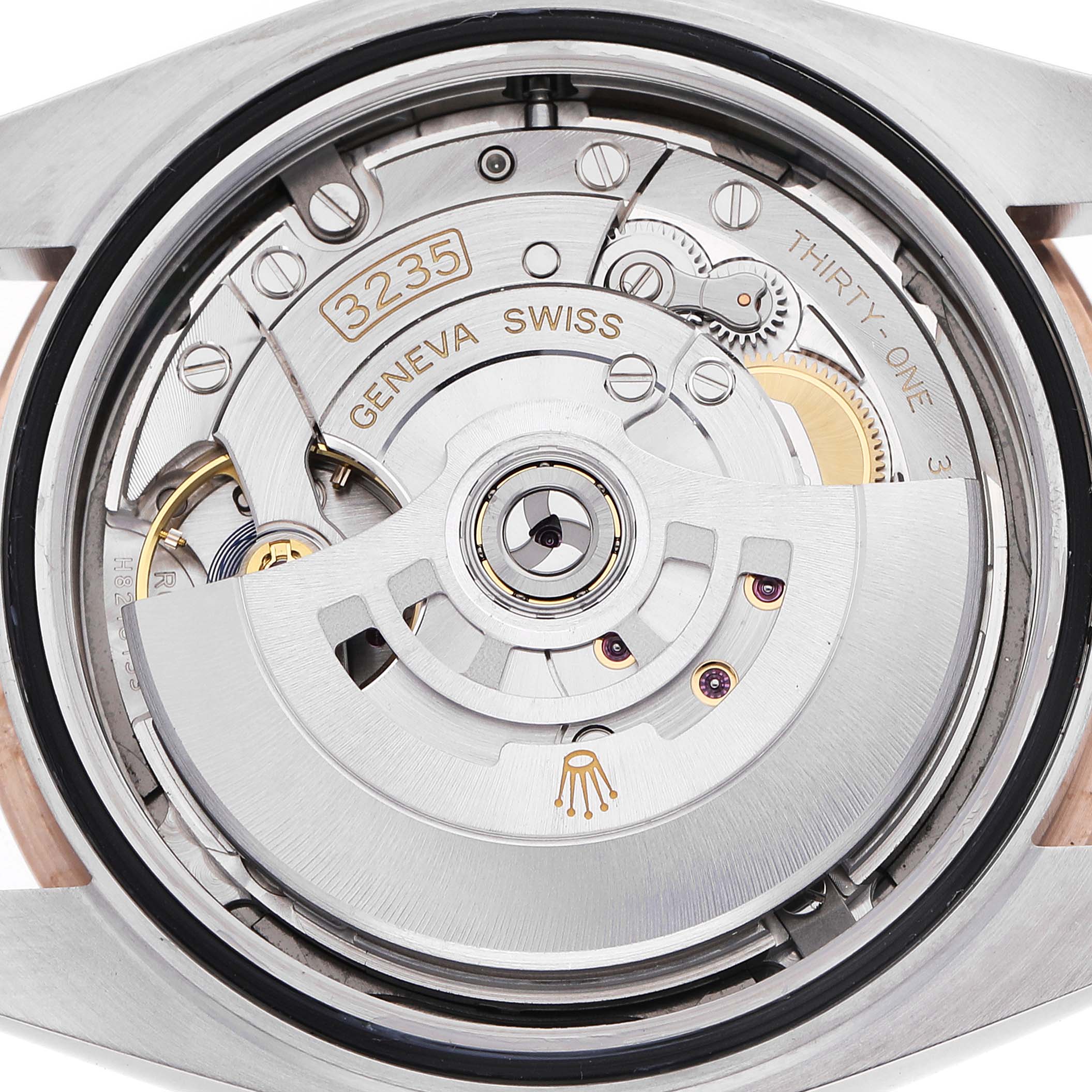 The image shows the inner mechanical movement of the Rolex Datejust 41 126301 Men's Steel and Gold (two tone) Grey Dial, viewed from the back with visible gears and the rotor.