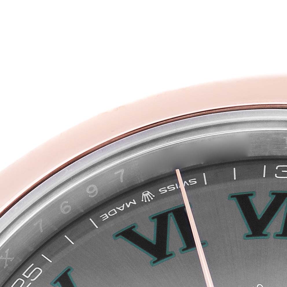 The image shows a partial close-up of the Rolex Datejust 41 126301 Men's Steel and Gold (two tone) Grey Dial watch's dial, focusing on the edge and hour markings.