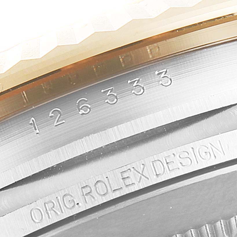 This image shows a close-up of the serial number and bezel of a Rolex Datejust 41 126333 Men's Steel and Gold (two tone) Grey Dial 126333 Men's Steel and Gold (two tone) Grey Dial watch.