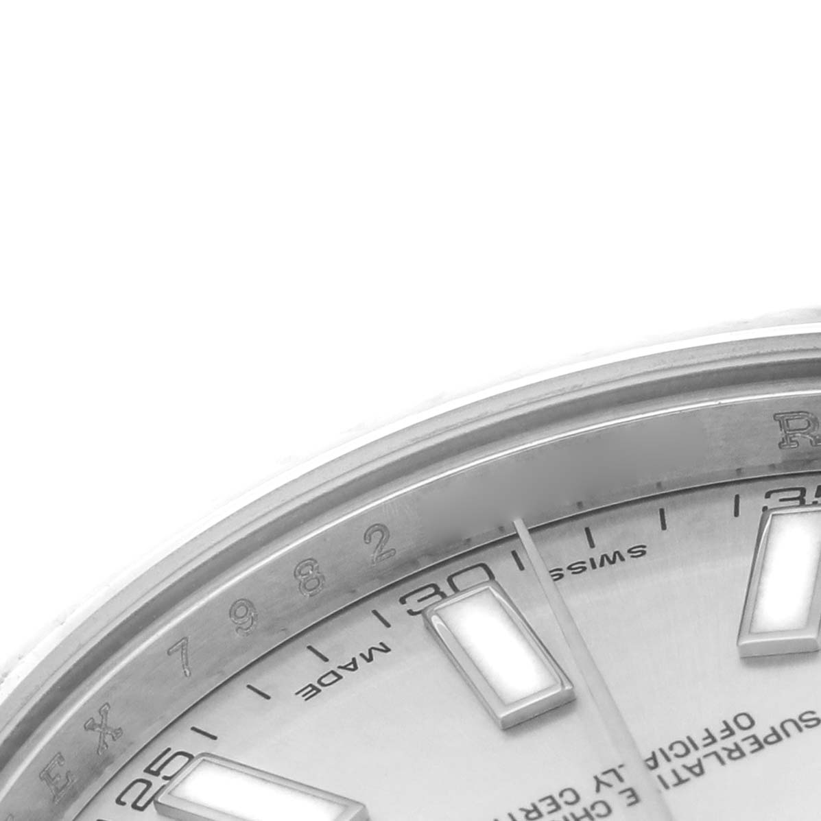 The image shows a close-up of the Rolex Datejust 41 116334 Men's Stainless Steel Silver Dial's dial, featuring the 25 to 35-minute markers and part of the bezel.