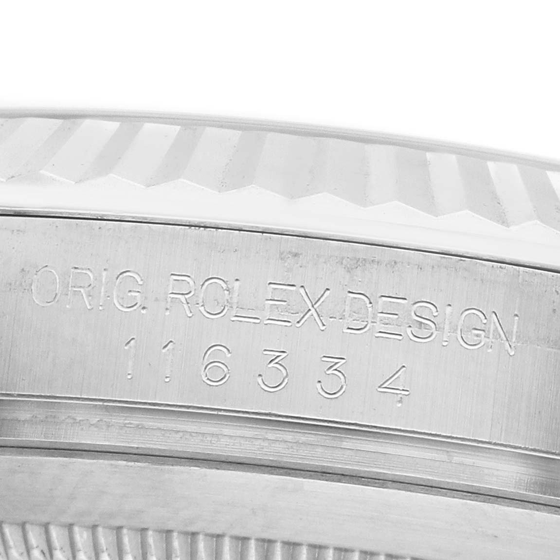 The image shows a close-up of the side case and bezel of a Rolex Datejust 41 116334 Men's Stainless Steel Silver Dial, with engraving visible.