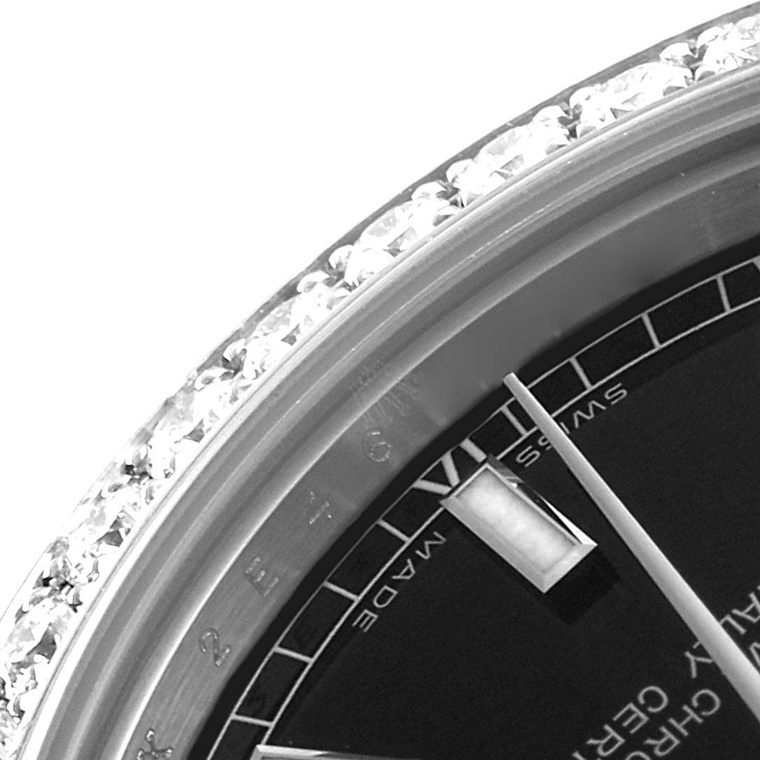 The image shows a close-up angled view of the bezel and dial of a Mid-Size Rolex watch.