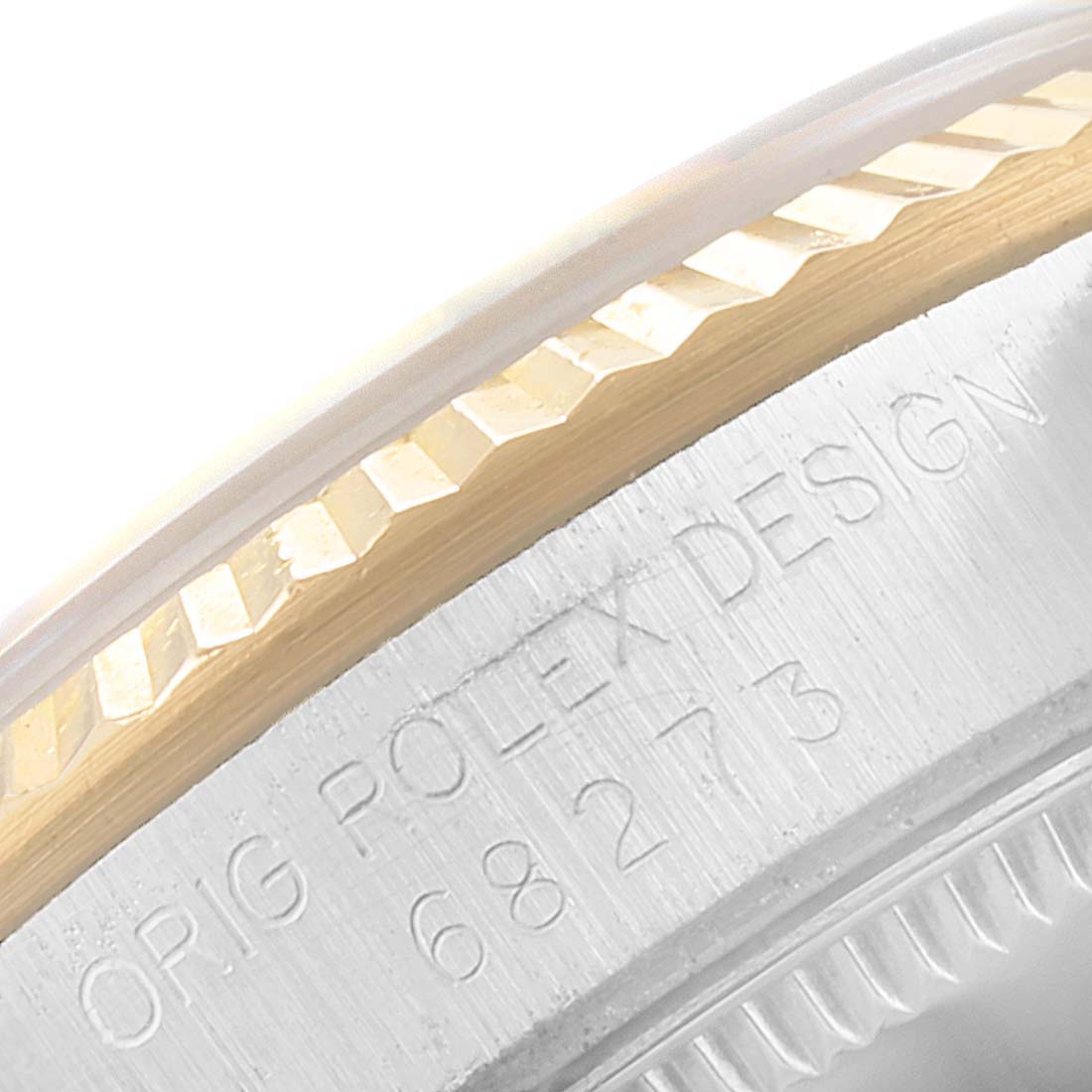 This image shows a close-up of the bezel and part of the case of the Mid-Size Rolex watch, featuring the "Orig Rolex Design" inscription.