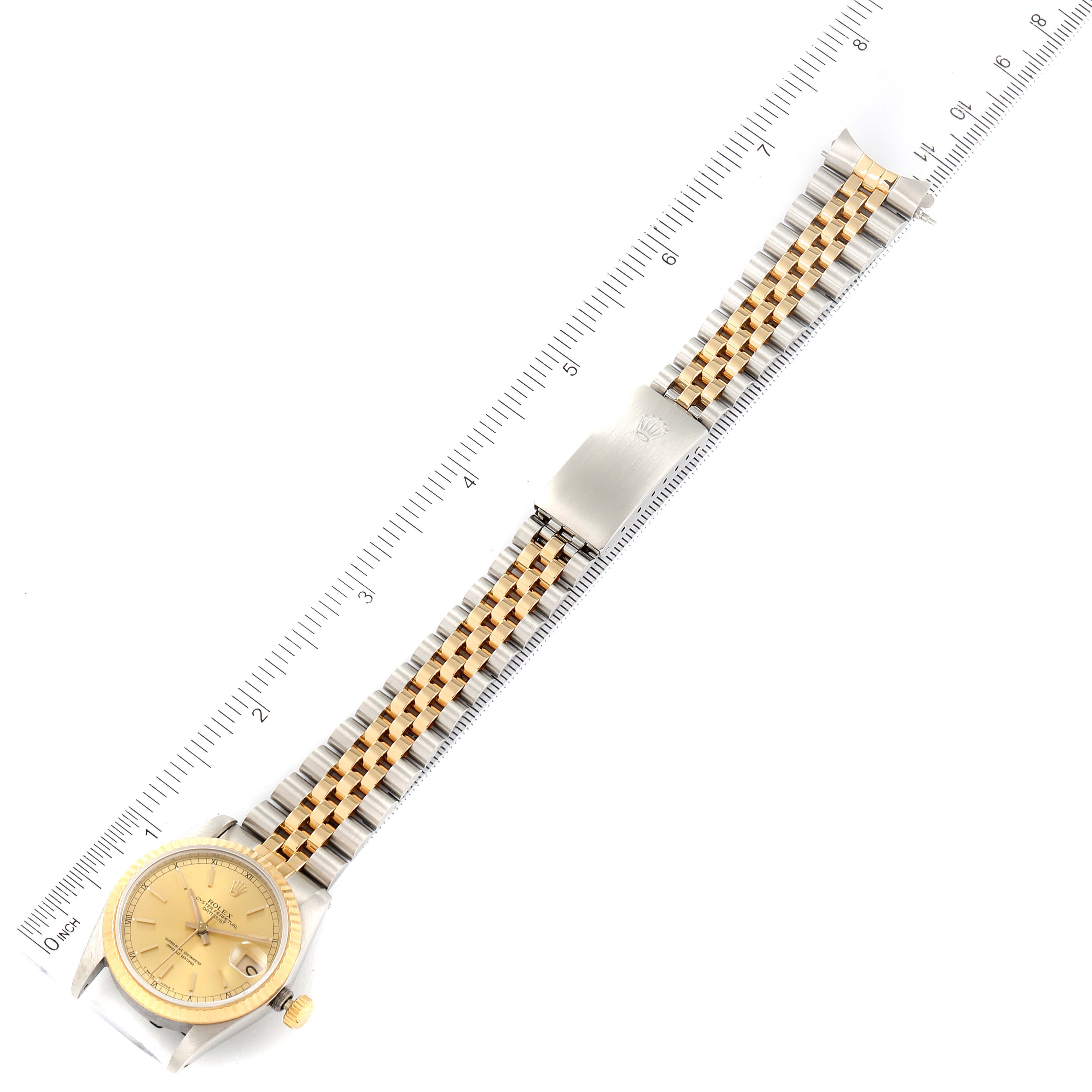 The Rolex Mid-Size 68273 Women's Stainless Steel Champagne Dial 68273 Women's Stainless Steel Champagne Dial model watch is shown from a top view, displaying the full length of the band, clasp, and face.