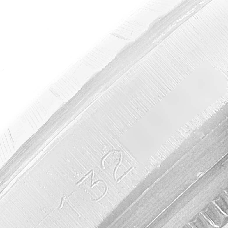 Close-up angle of the Rolex Datejust 1603 Men
s Stainless Steel Silver Dial 1603 Men
s Stainless Steel Silver Dial showing the case with engraved markings.