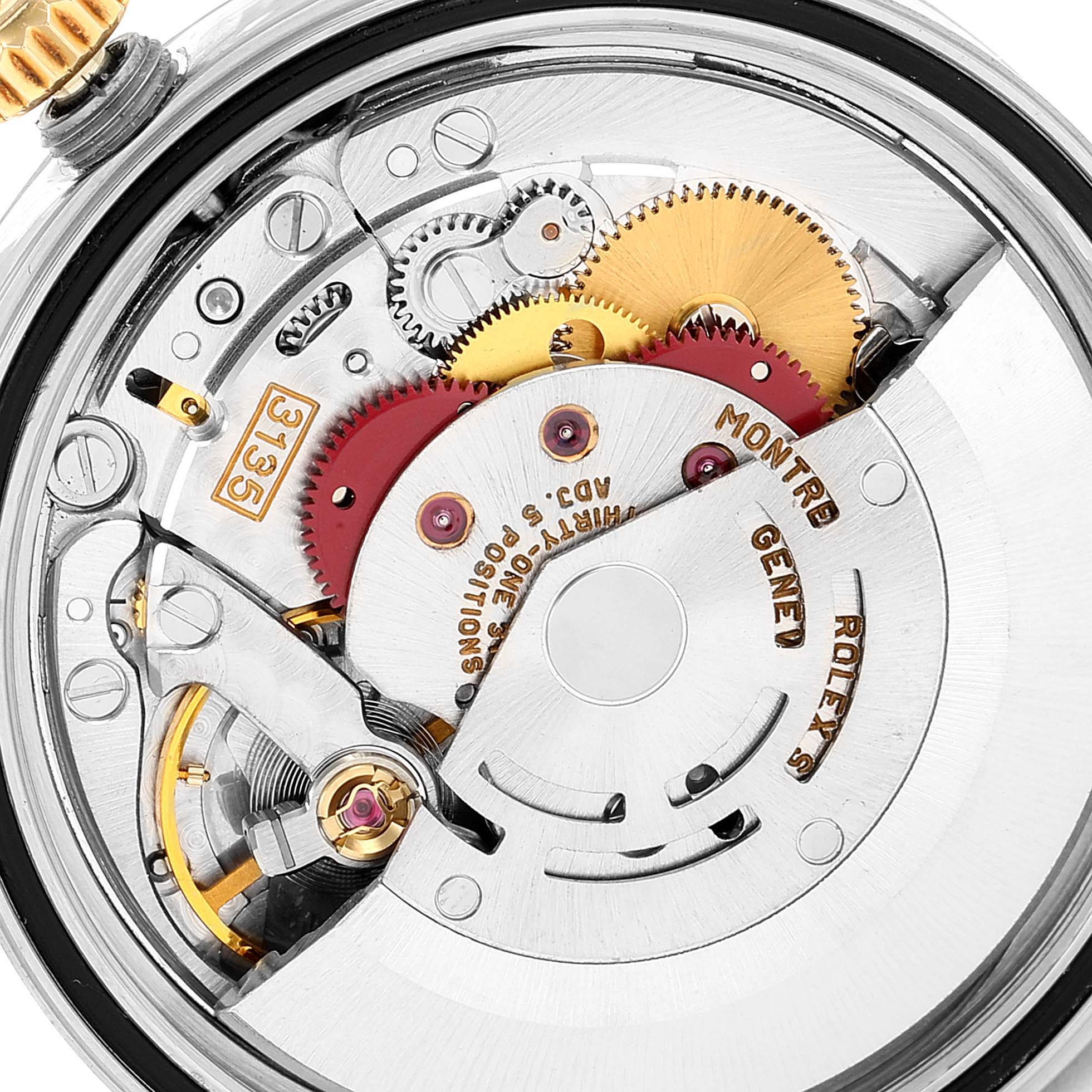 This image shows a close-up view of the movement mechanism inside a Rolex Datejust 16233 Men's Steel and Gold (two tone) White Dial 16233 Men's Steel and Gold (two tone) White Dial watch, highlighting the gears and cogs.