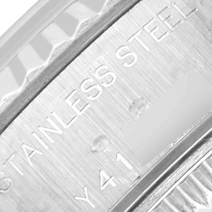 The image shows a close-up of the stainless steel back of a Rolex Datejust 79174 Women's Stainless Steel Silver Dial 79174 Women's Stainless Steel Silver Dial watch with engraved text.