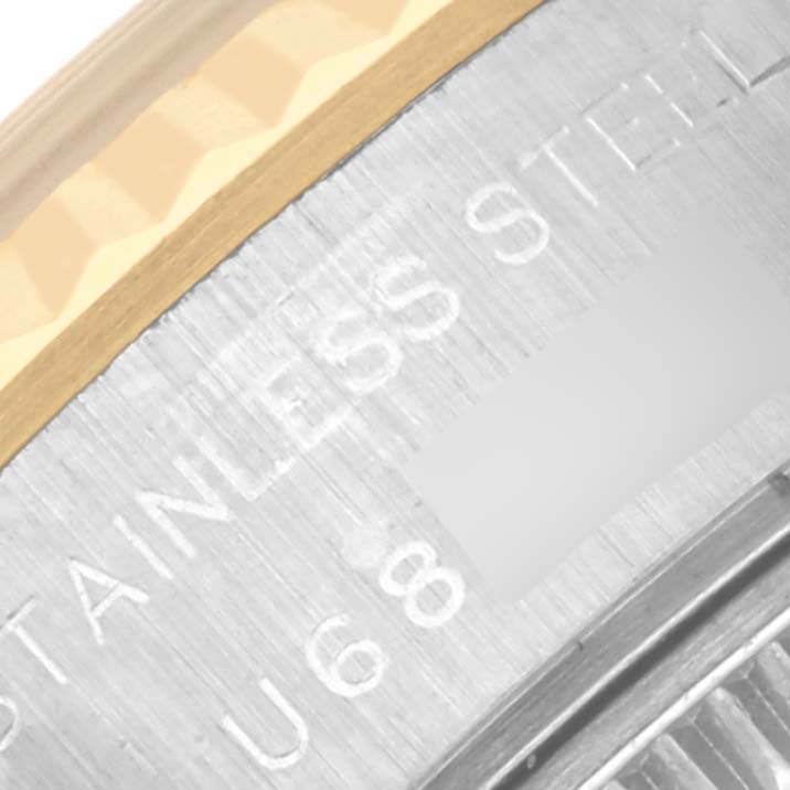 The image shows a close-up of the case back edge and fluted bezel of a Rolex Datejust 69173 Women's Steel and Gold (two tone) Champagne Dial 69173 Women's Steel and Gold (two tone) Champagne Dial watch, highlighting "STAINLESS STEEL."