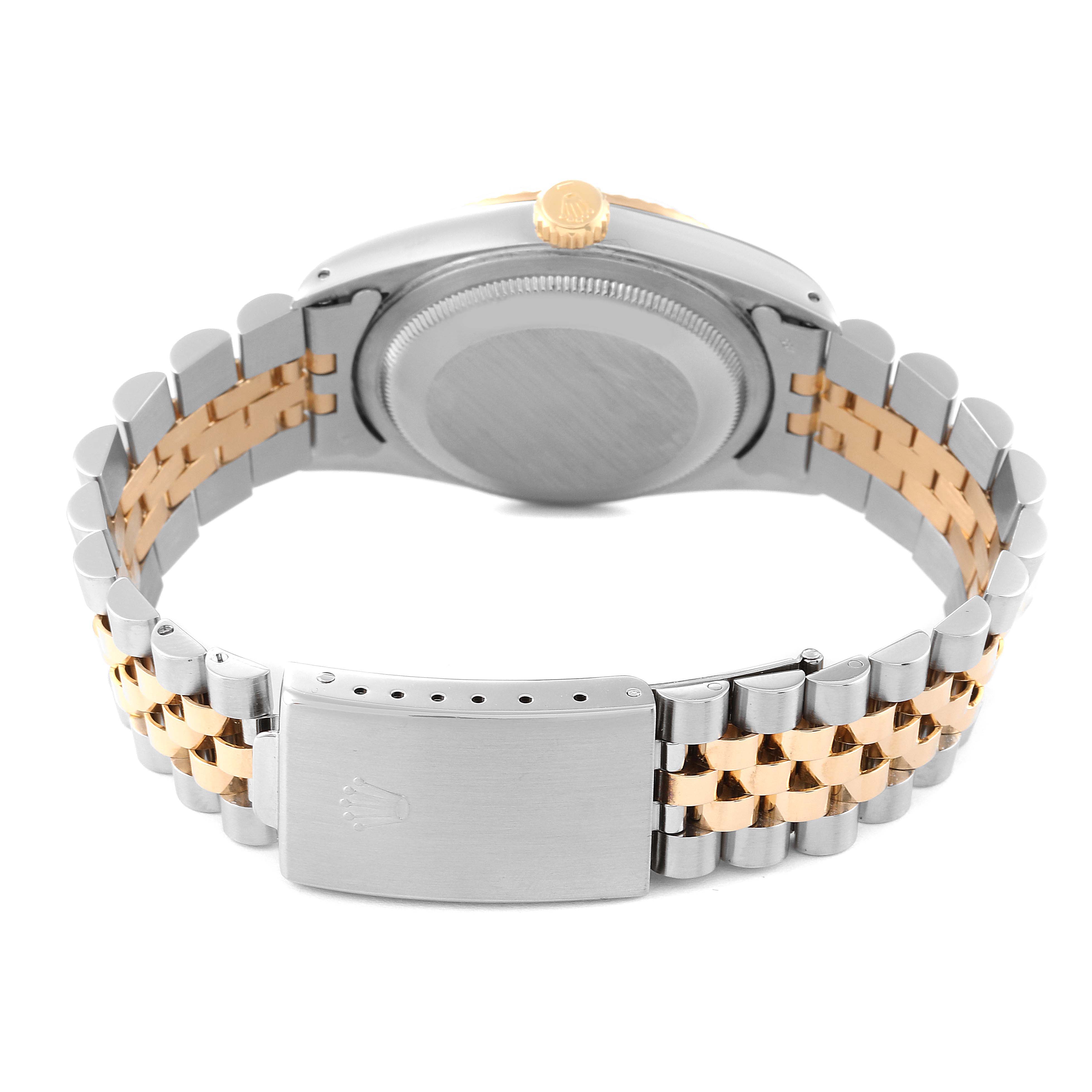 The image shows the back view of a Rolex Datejust 16233 Men's Steel and Gold (two tone) Champagne Dial 16233 Men's Steel and Gold (two tone) Champagne Dial watch, highlighting its clasp and two-tone bracelet.