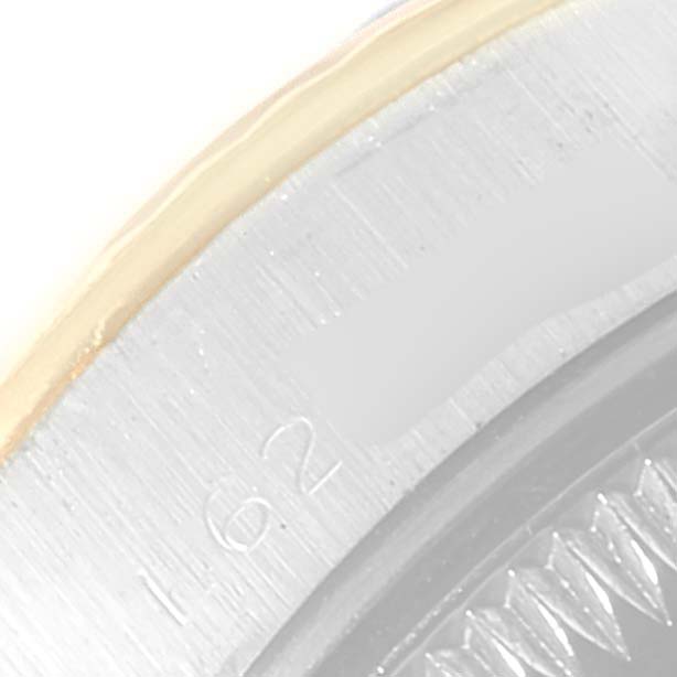 The image shows a close-up angle of the edge of a Rolex Datejust 69173 Women's Steel and Gold (two tone) Silver Dial 69173 Women's Steel and Gold (two tone) Silver Dial watch case and the rehaut engraving.