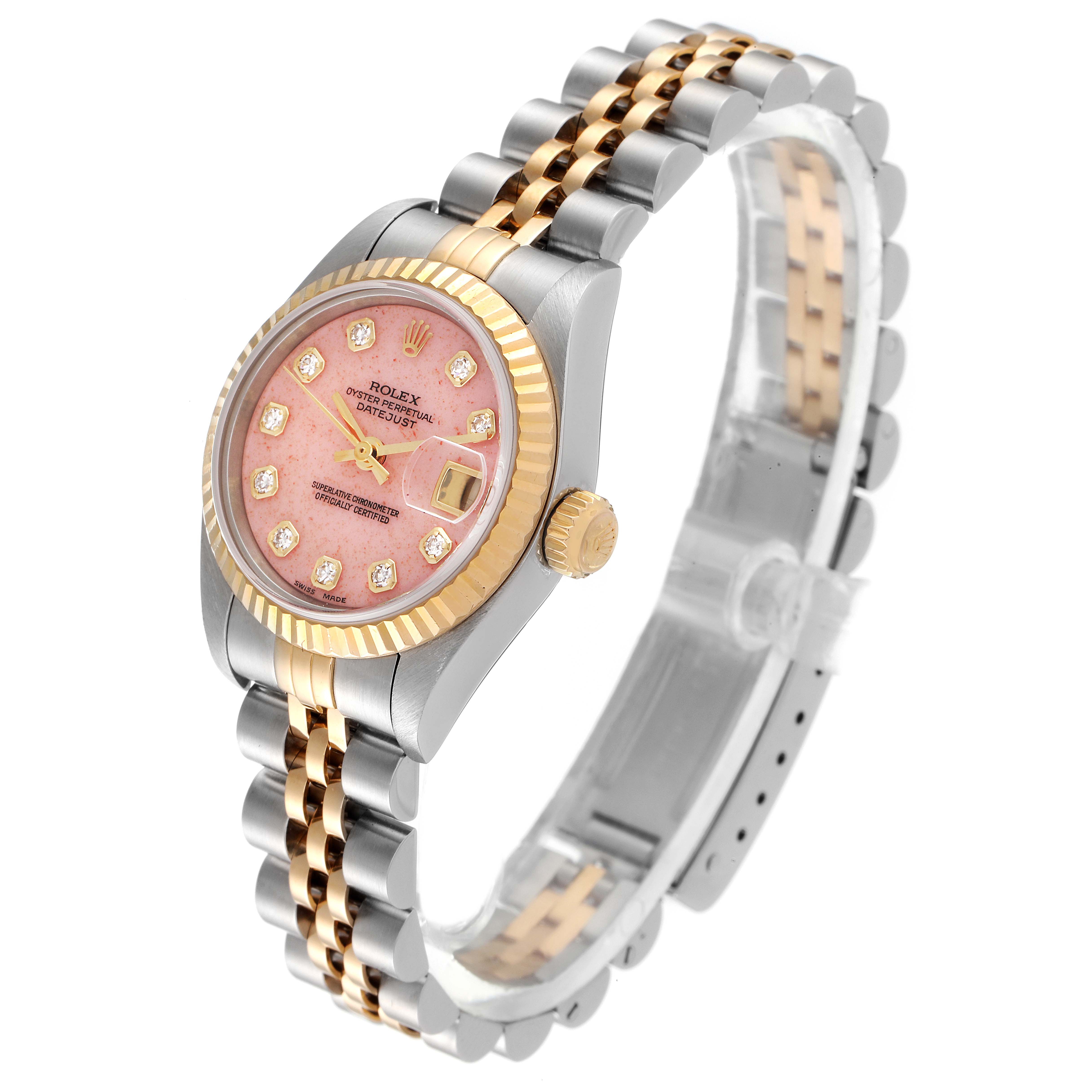 This image shows a Rolex Datejust 79173 Women's Steel and Gold (two tone) Pink Dial 79173 Women's Steel and Gold (two tone) Pink Dial watch at an angle focusing on its pink dial, bi-metal band, and ridged bezel.