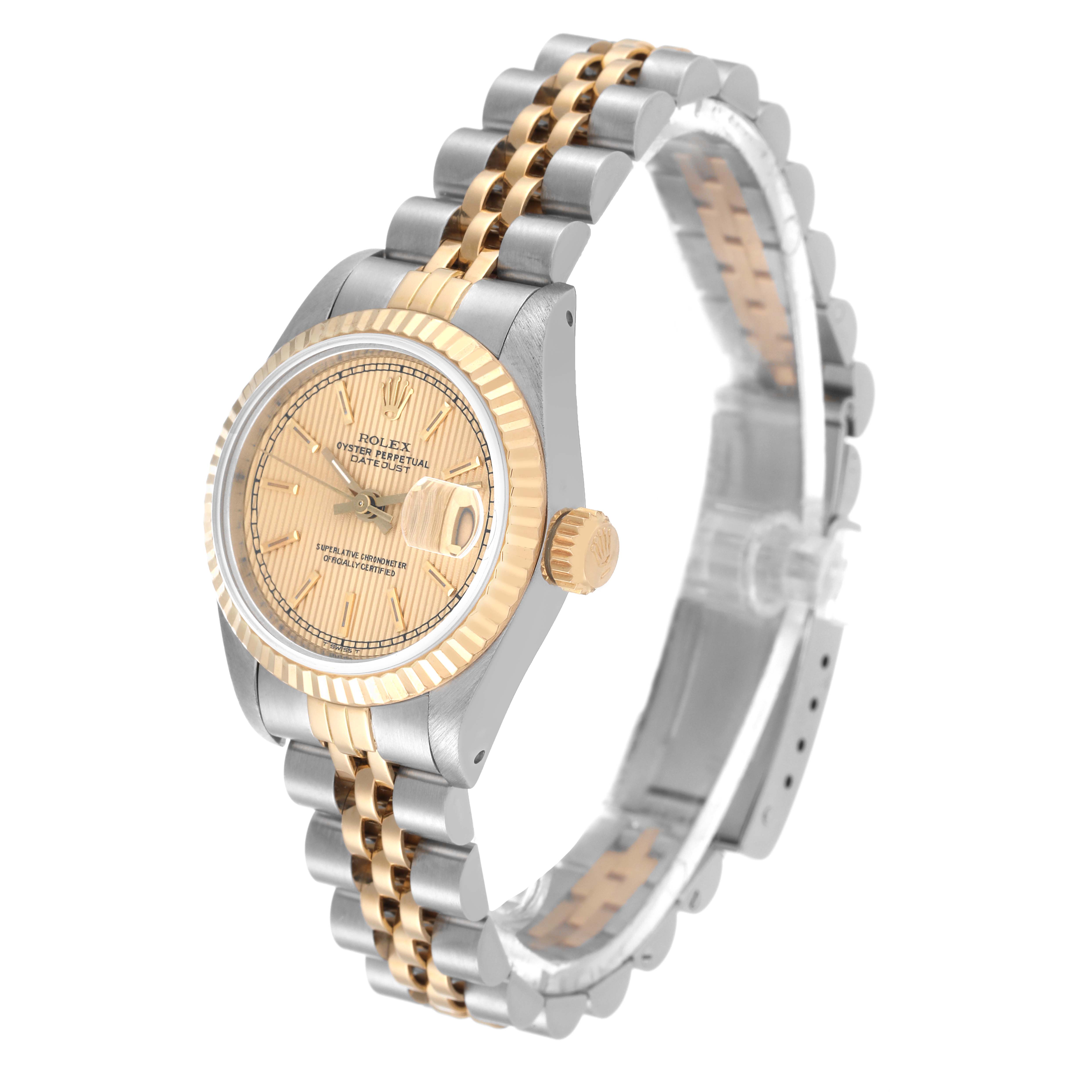 The image shows a side and front angle of a Rolex Datejust 69173 Women's Steel and Gold (two tone) Champagne Dial 69173 Women's Steel and Gold (two tone) Champagne Dial watch, highlighting its two-tone bracelet and fluted bezel.