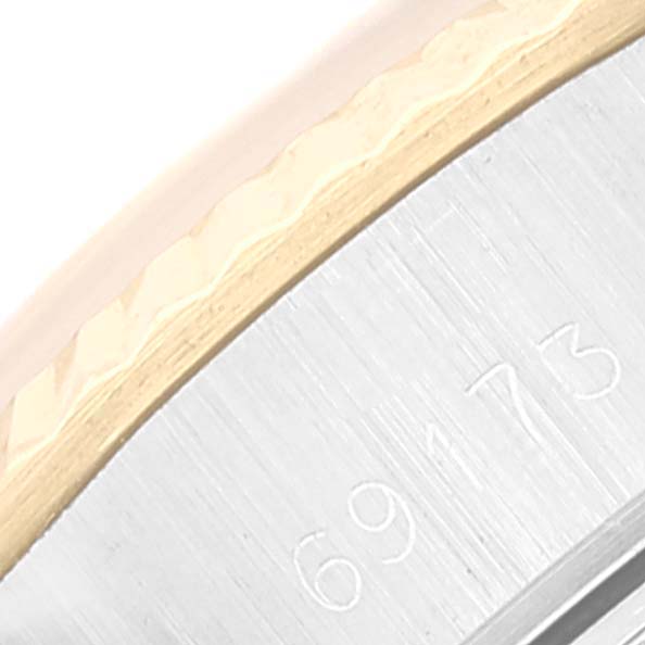 The image shows a close-up of the bezel and part of the case's side with the engraved model number of a Rolex Datejust 69173 Women's Steel and Gold (two tone) Champagne Dial 69173 Women's Steel and Gold (two tone) Champagne Dial watch.