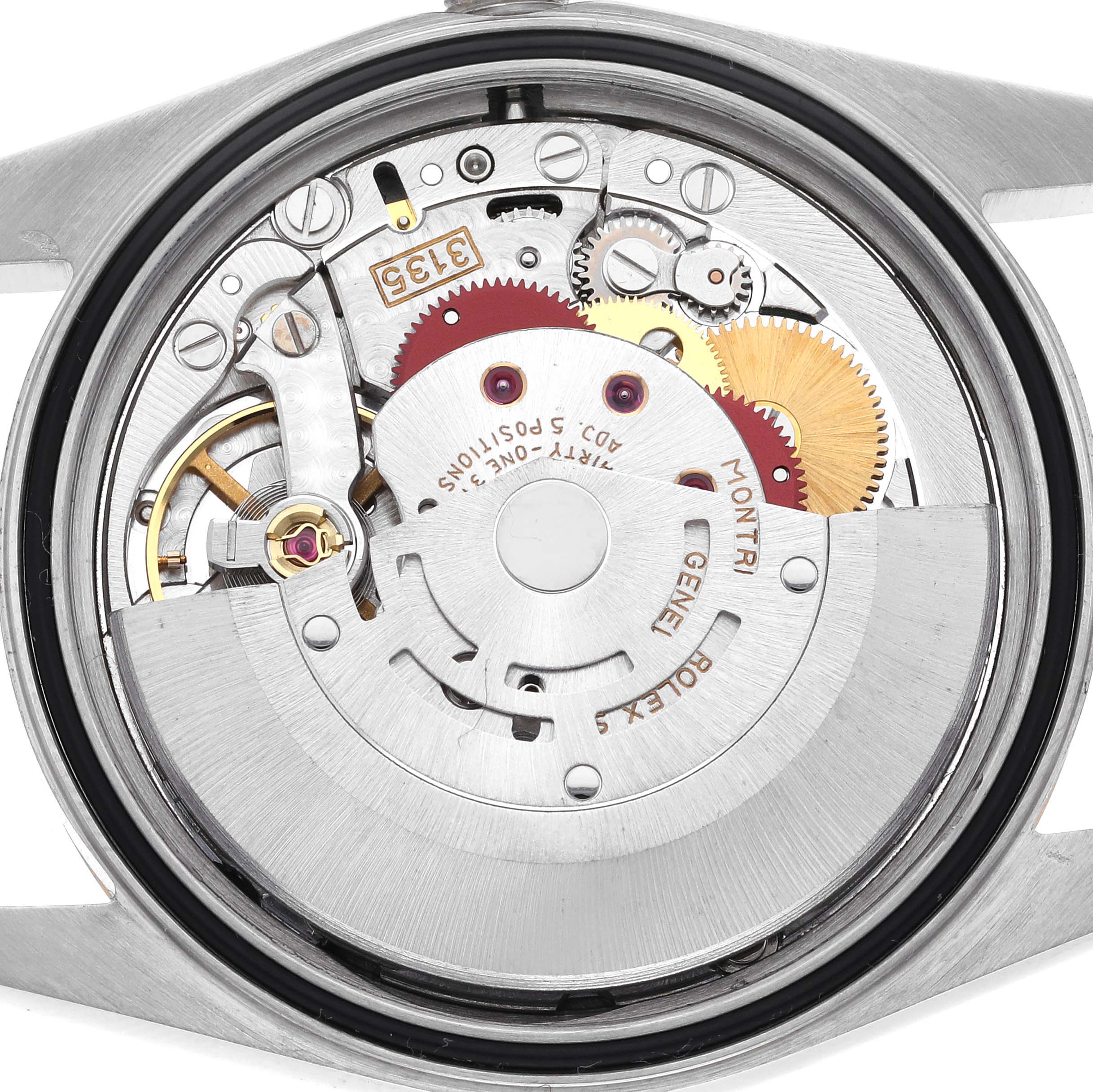 The image shows the movement of a Rolex Datejust 16233 Men's Steel and Gold (two tone) White Dial 16233 Men's Steel and Gold (two tone) White Dial watch from the back, highlighting gears and components.
