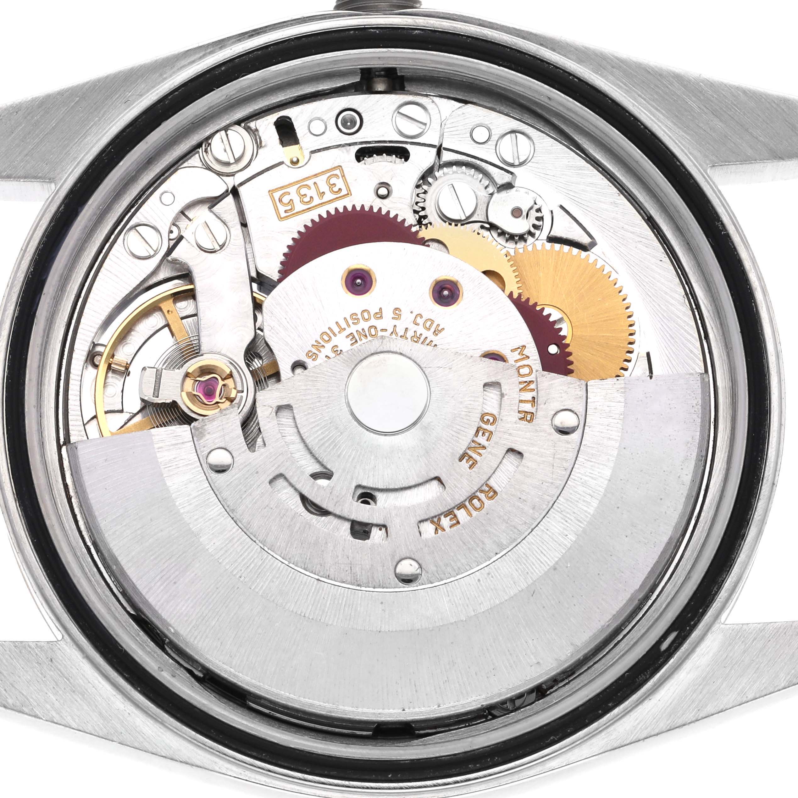 The image shows the movement and internal mechanism of the Rolex Datejust 16233 Men's Steel and Gold (two tone) White Dial 16233 Men's Steel and Gold (two tone) White Dial watch from a back angle.