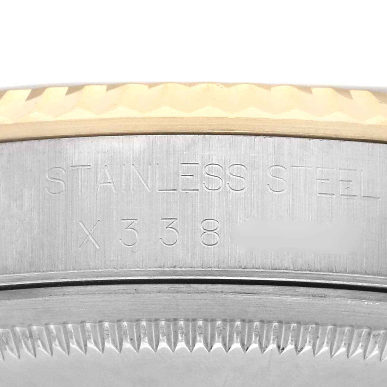 The image shows the engraving on the side of a Rolex Datejust 16233 Men's Steel and Gold (two tone) White Dial 16233 Men's Steel and Gold (two tone) White Dial watch case, highlighting its stainless steel material.