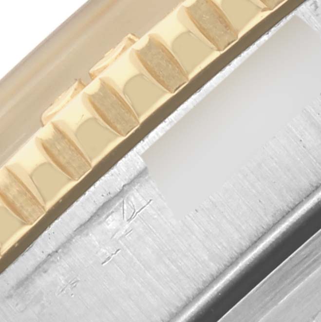 The image shows a close-up of the side of the bezel and case of a Rolex Vintage Collection 1625 Men's Steel and Gold (two tone) Silver Dial 1625 Men's Steel and Gold (two tone) Silver Dial watch.