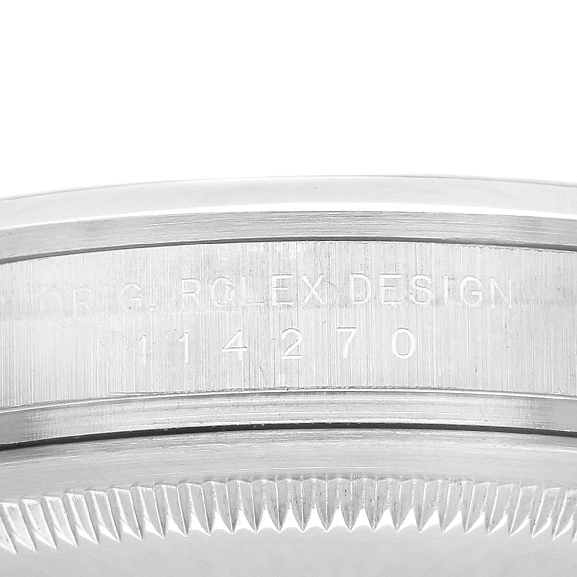 The image shows a close-up of the side case of a Rolex Explorer 114270 Men's Stainless Steel Black Dial, displaying the model number and design engraving.