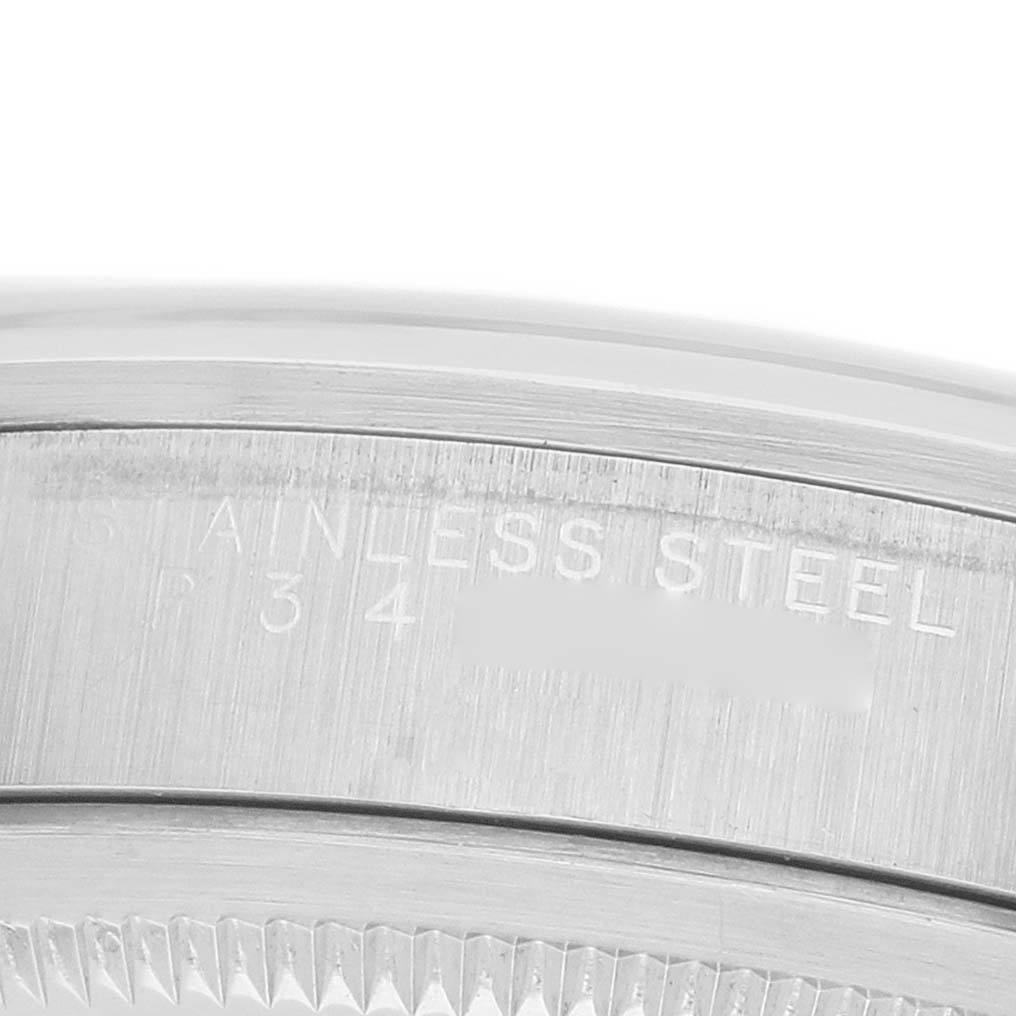 The image shows a close-up angle of the side engraving and bezel of a Rolex Explorer 14270 Men's Stainless Steel Black Dial model, focusing on the stainless steel text.