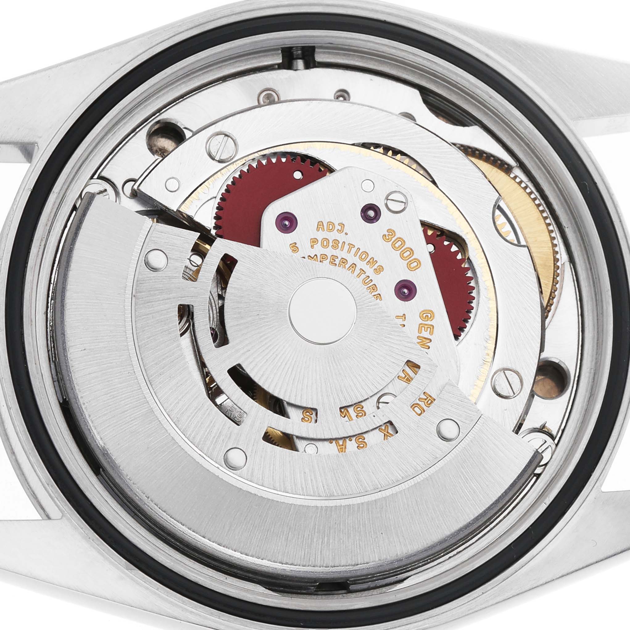 The image shows the movement of a Rolex Explorer 14270 Men's Stainless Steel Black Dial watch, focusing on its intricate mechanical components.