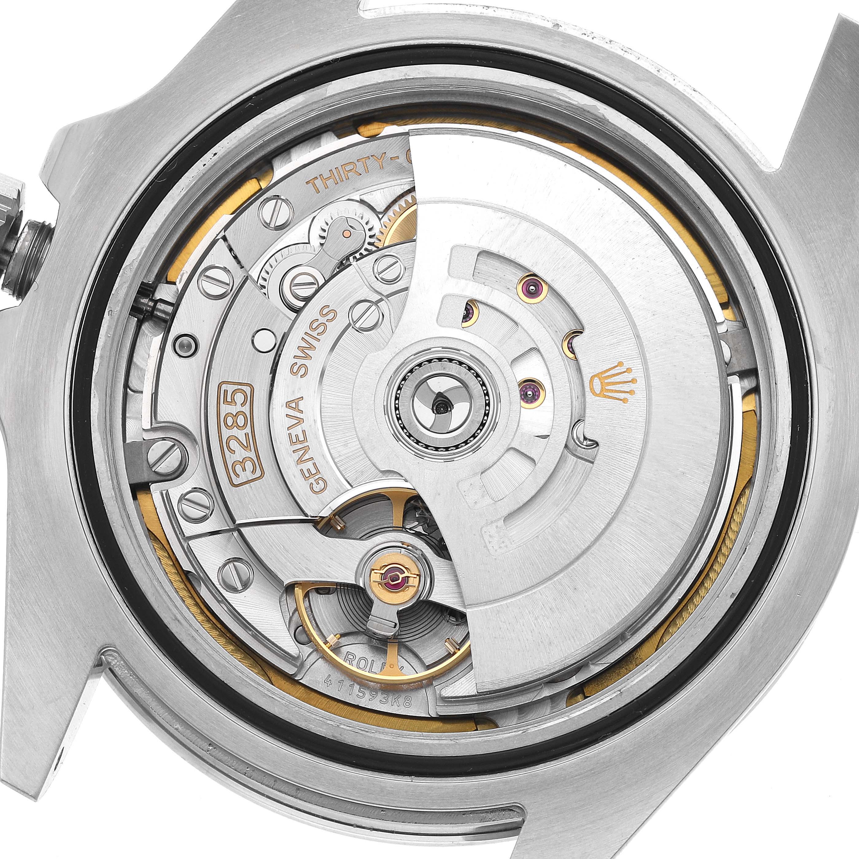 The image shows the movement and rotor of a Rolex Explorer 226570 Men's Stainless Steel Black Dial watch from the back, highlighting its intricate mechanical components.