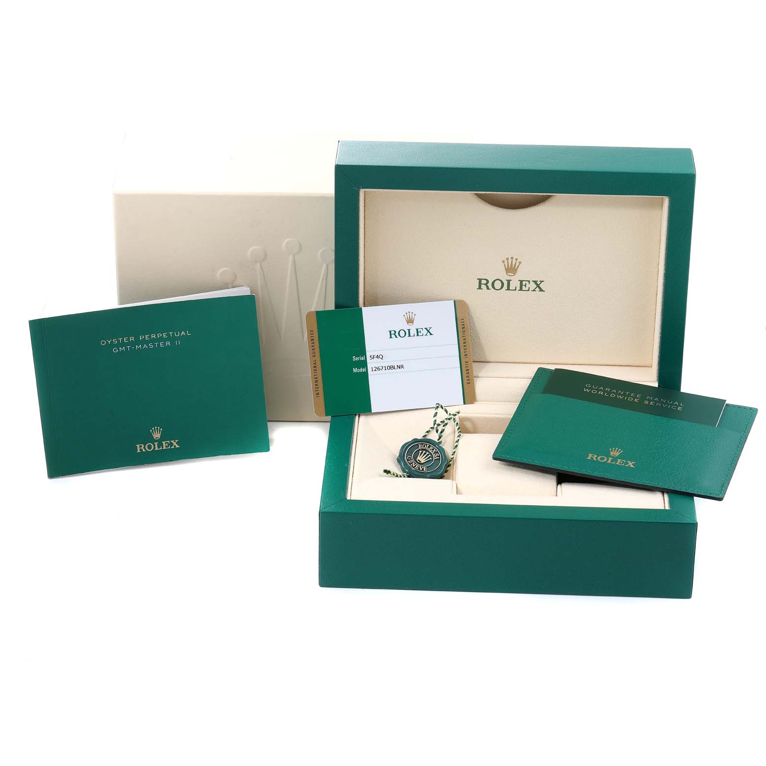 The image shows the packaging, manuals, guarantee card, and accessories for a Rolex GMT-Master 126710 Men
s Stainless Steel Black Dial 126710 Men
s Stainless Steel Black Dial II watch.