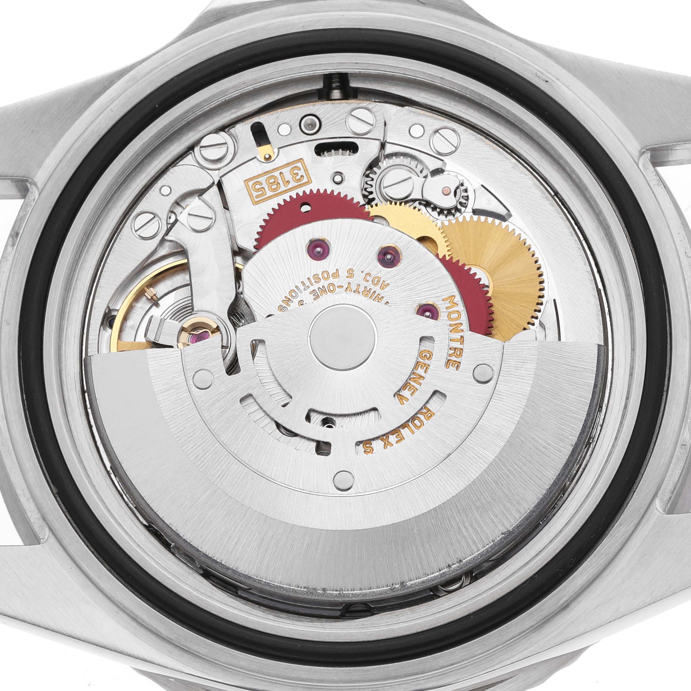 The image shows the back view of a Rolex GMT-Master 16710 Men's Stainless Steel Black Dial watch, highlighting its intricate movement and gears.