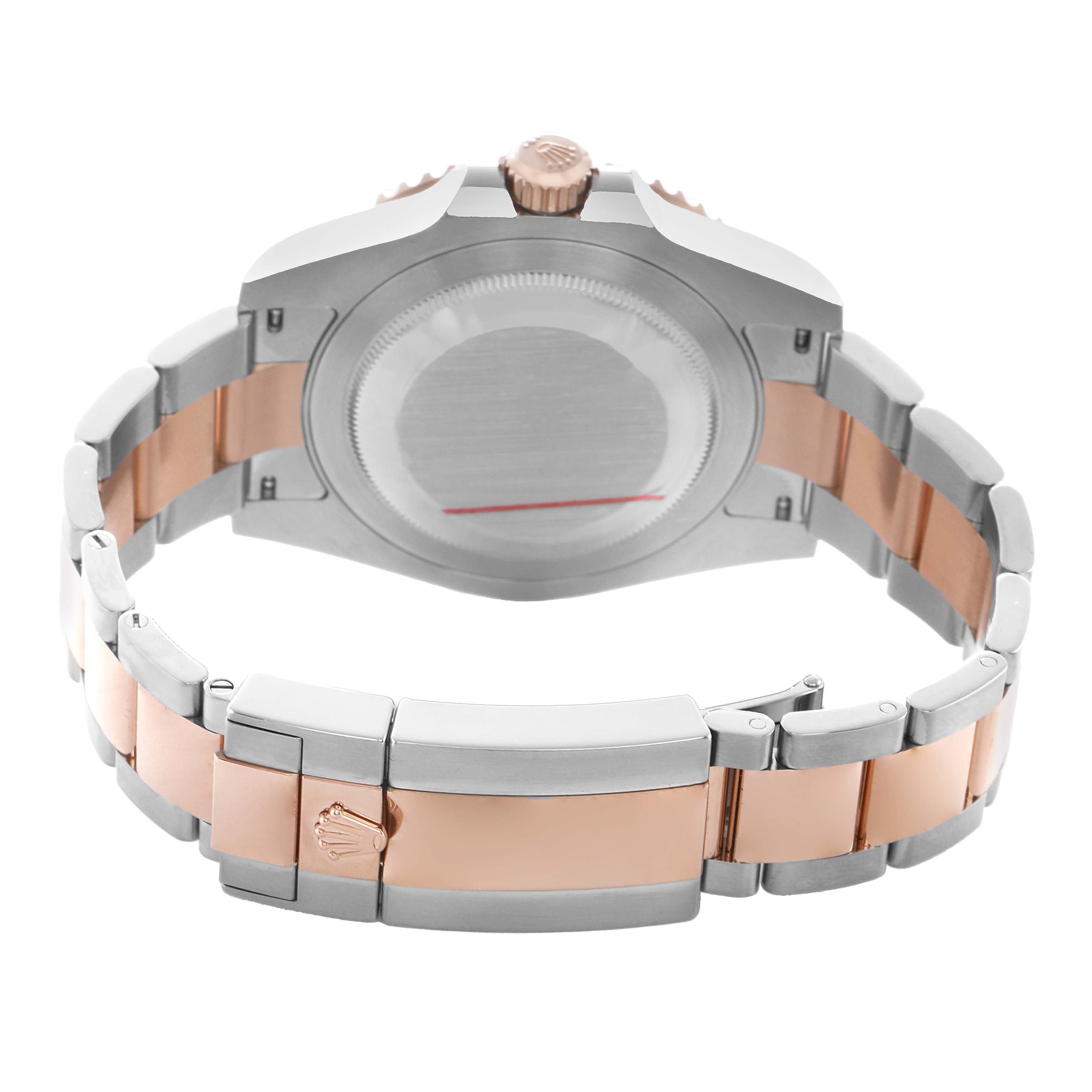 The image shows the back view of a Rolex GMT-Master 126711 Men's Steel and Gold (two tone) Black Dial, highlighting the case back, crown, and two-tone bracelet.