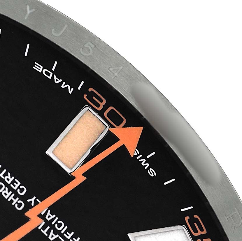 The image shows a close-up of a Rolex Milgauss 116400GV Men's Stainless Steel Black Dial watch face, highlighting the orange lightning bolt second hand and part of the dial markings.