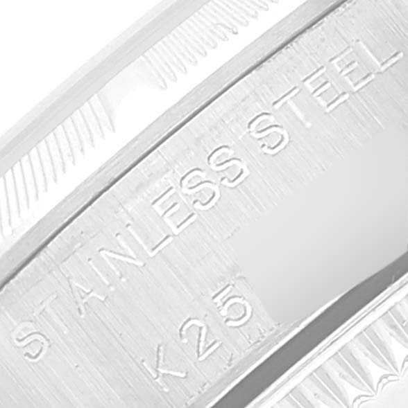 This image shows a close-up of the stainless steel part with engraved markings of the Rolex Oyster Perpetual 76030 Women's Stainless Steel Black Dial 76030 Women's Stainless Steel Black Dial watch.