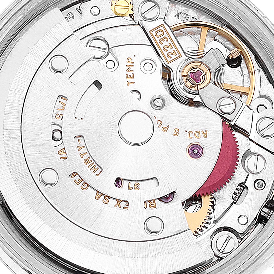 This close-up image of a Rolex Oyster Perpetual 76030 Women's Stainless Steel Black Dial 76030 Women's Stainless Steel Black Dial watch shows the intricate details of its internal mechanical movement.