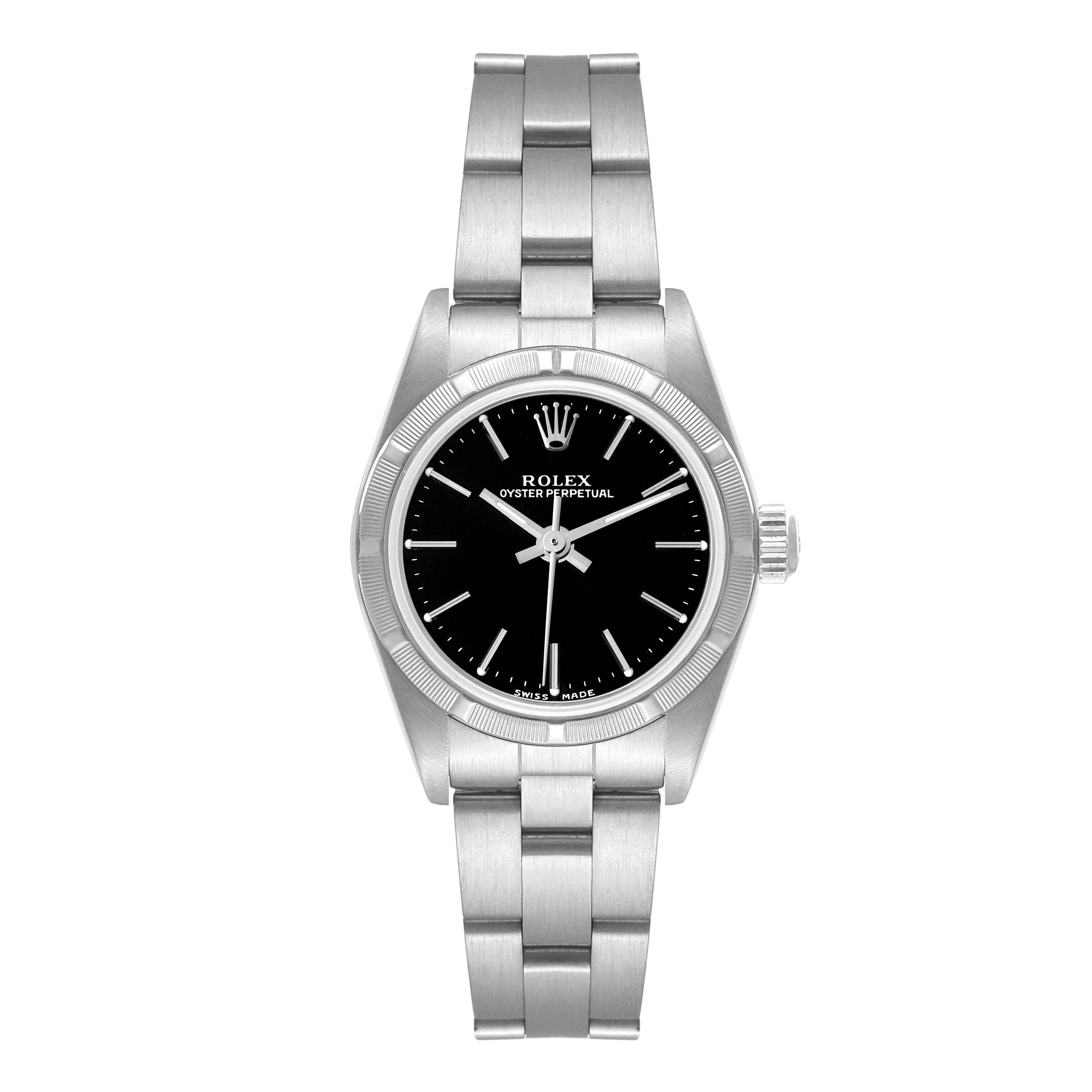The image shows a Rolex Oyster Perpetual 76030 Women's Stainless Steel Black Dial 76030 Women's Stainless Steel Black Dial watch from a top-down angle, highlighting its face, bezel, and bracelet.